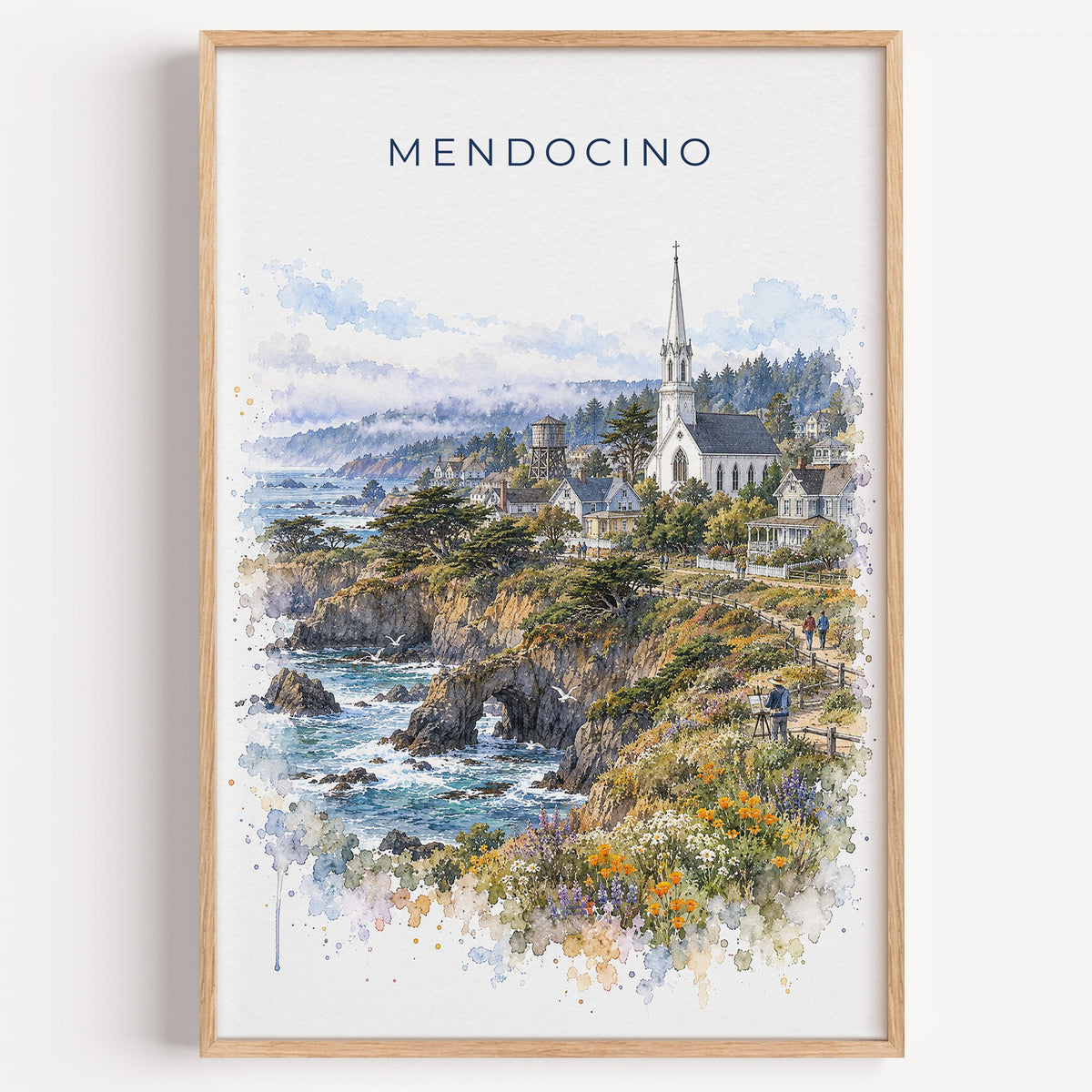 Mendocino watercolor print in a light oak frame on a plain white wall