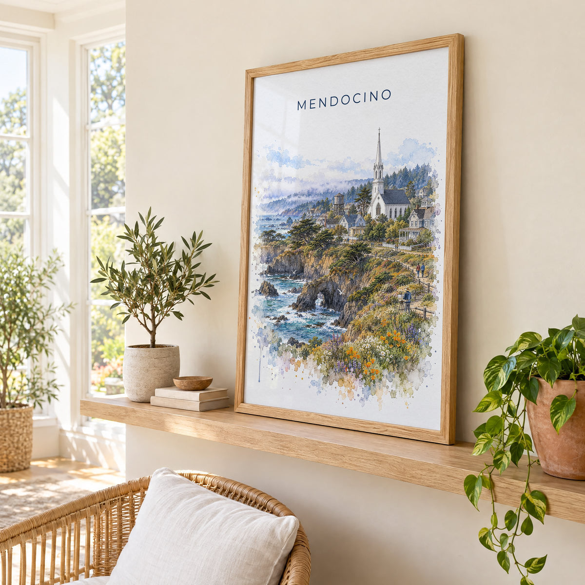 Mendocino watercolor print in an oak frame on a picture ledge in a sunlit sunroom