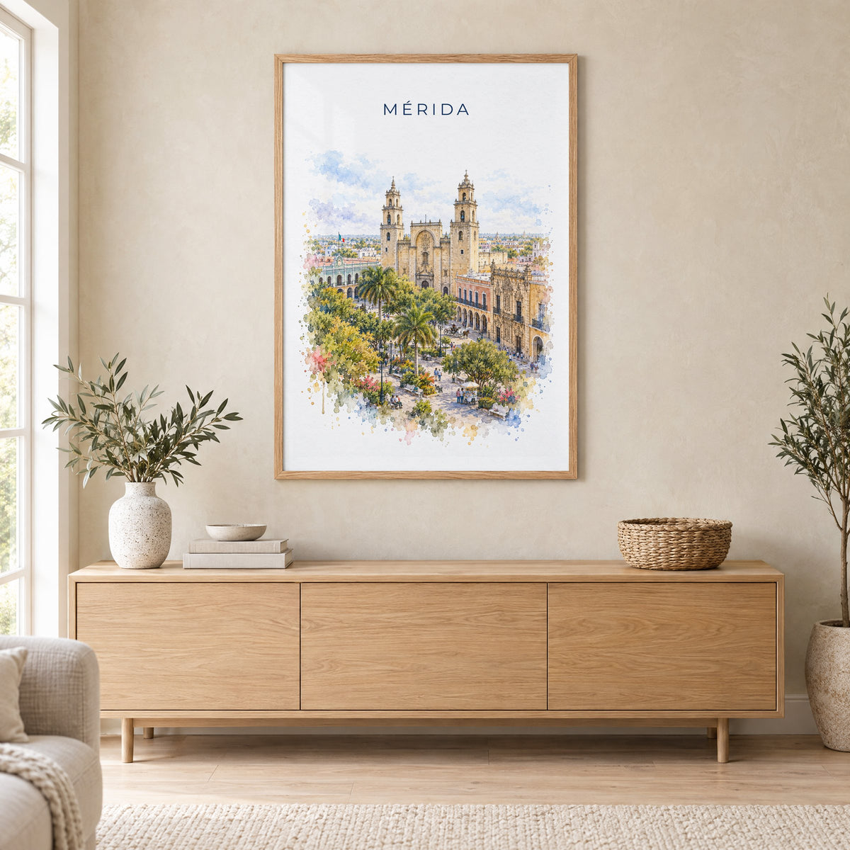 Merida, Mexico watercolor print in an oak frame above a light wood sideboard in a Scandinavian living room