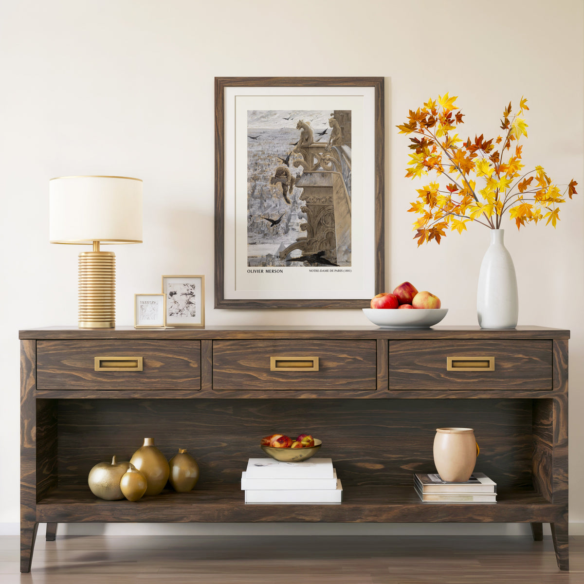 Notre-Dame de Paris print in a walnut frame above a console with branches