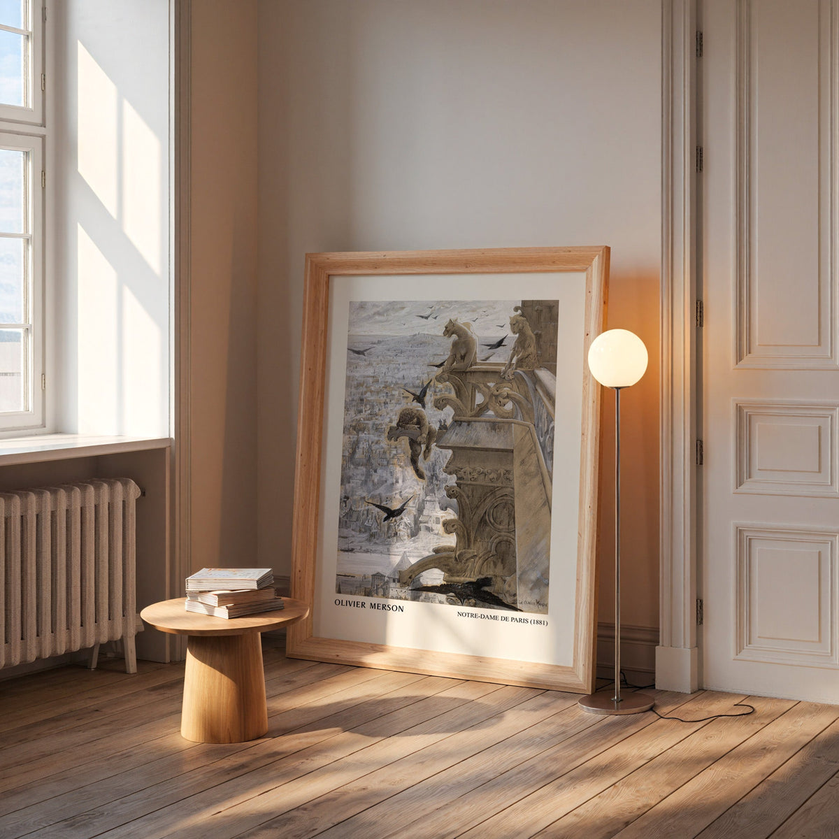 Notre-Dame print in a wide pine frame leaning by a sunlit window