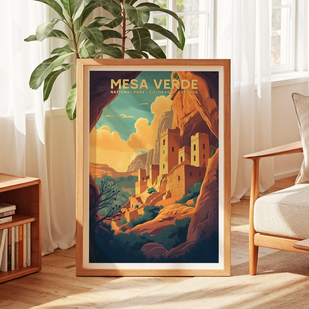 Mesa Verde National Park print in an oak frame by a sunlit window with sheer curtains and a fig plant
