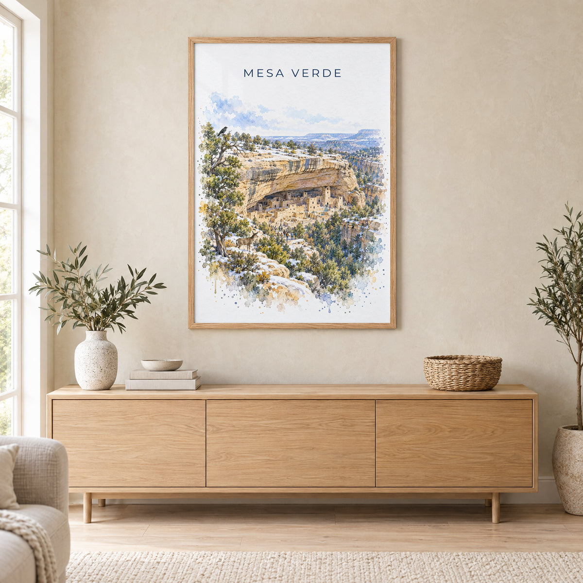 Mesa Verde National Park watercolor print in an oak frame above a light wood sideboard in a Scandinavian living room