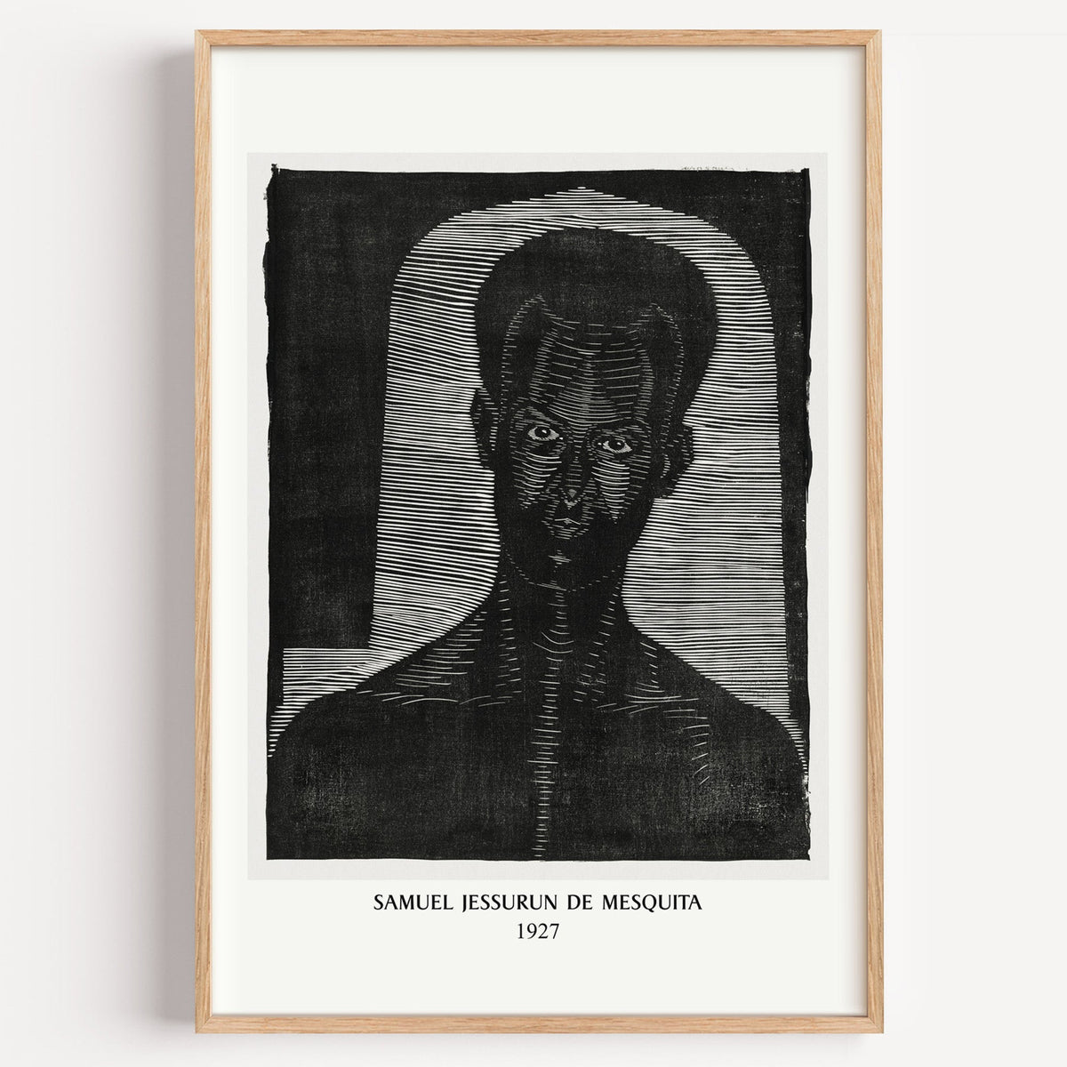 Mesquita woodcut portrait print in a light oak frame on a plain white wall