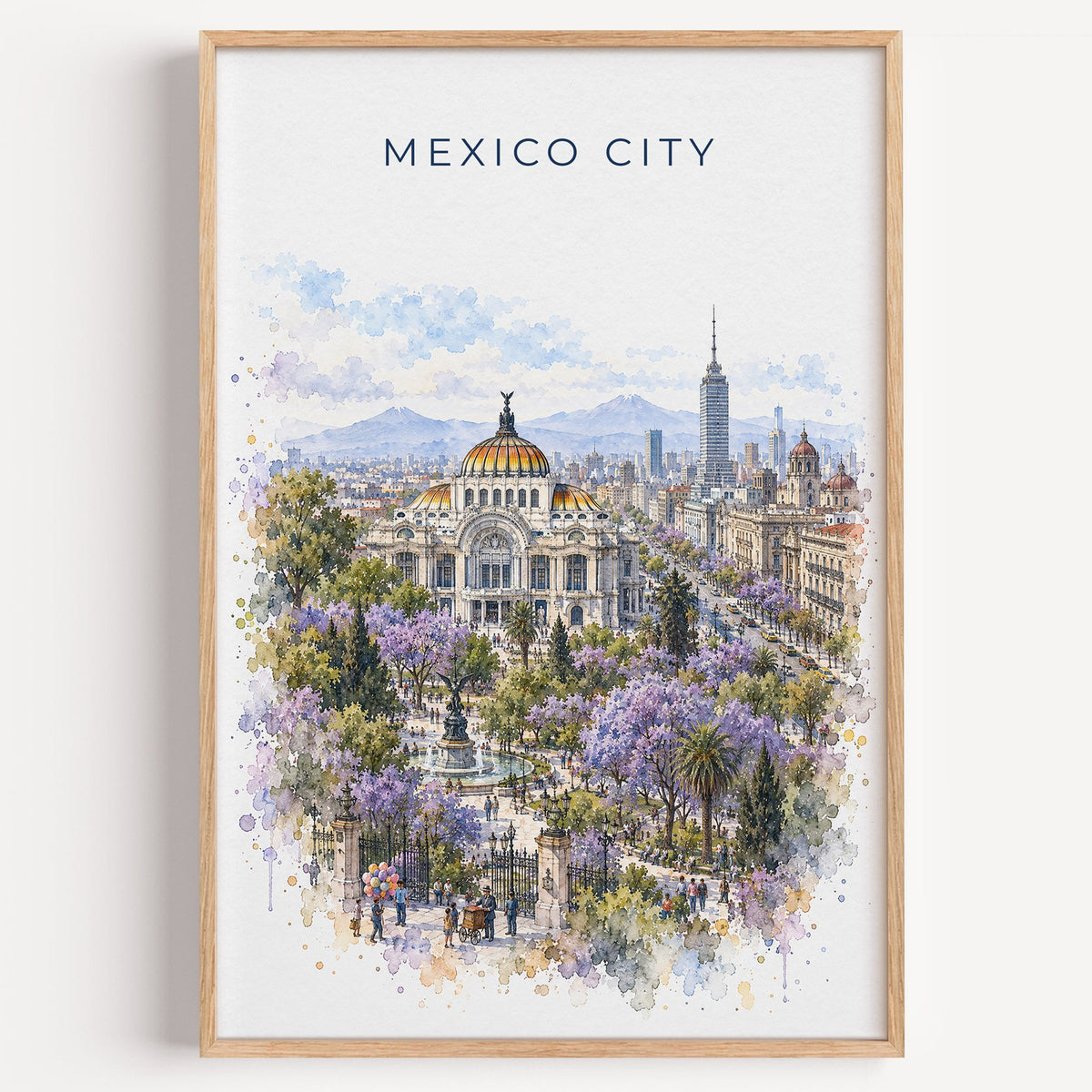 Mexico City watercolor print in a light oak frame on a plain white wall