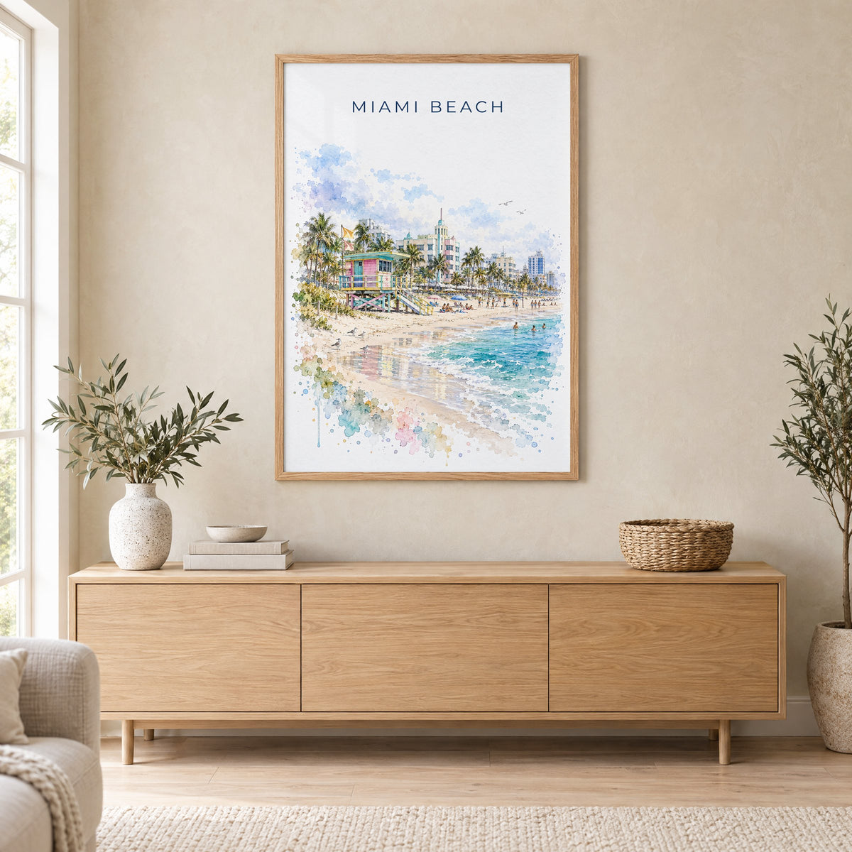 Miami Beach watercolor print in an oak frame above a light wood sideboard in a Scandinavian living room