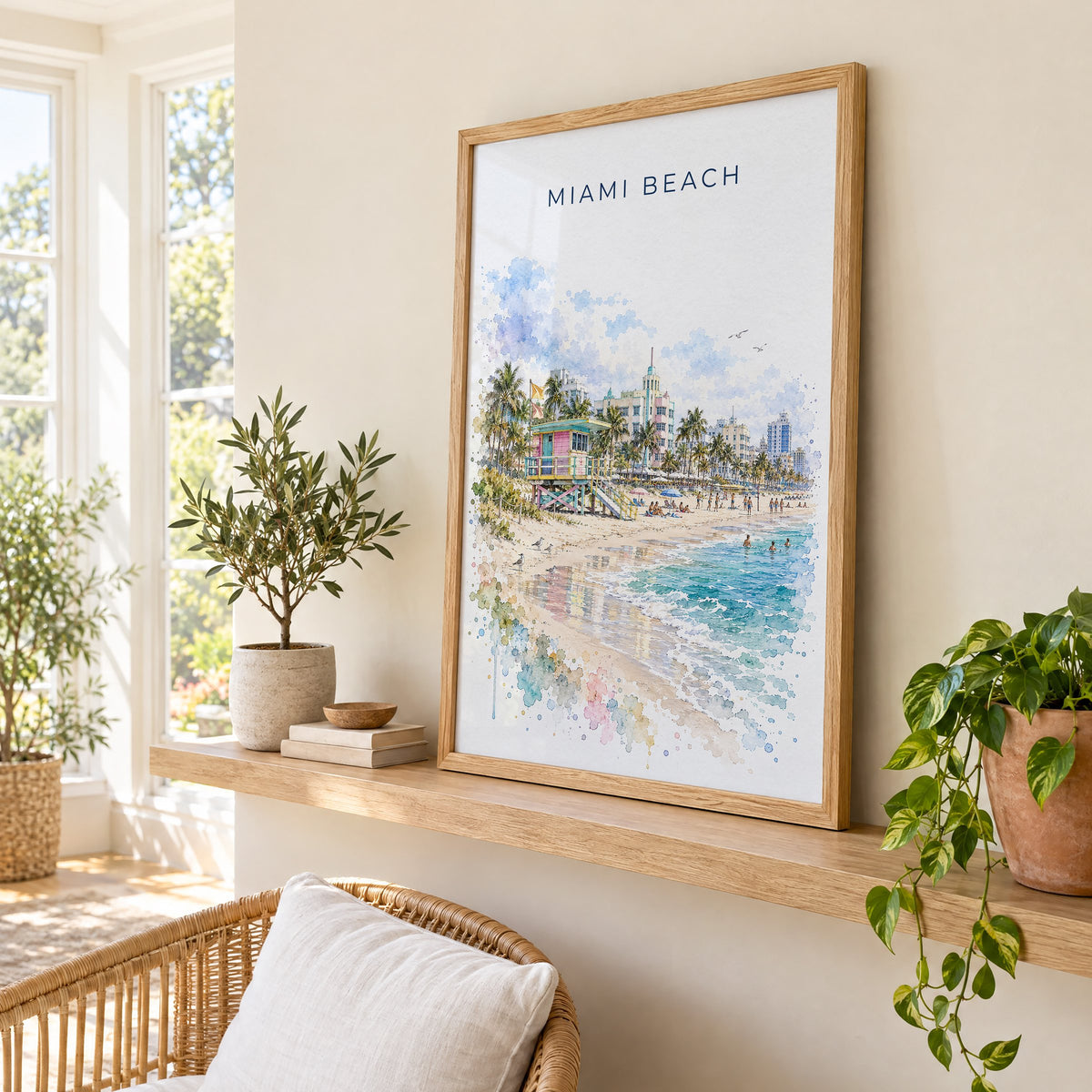 Miami Beach watercolor print in an oak frame on a picture ledge in a sunlit sunroom