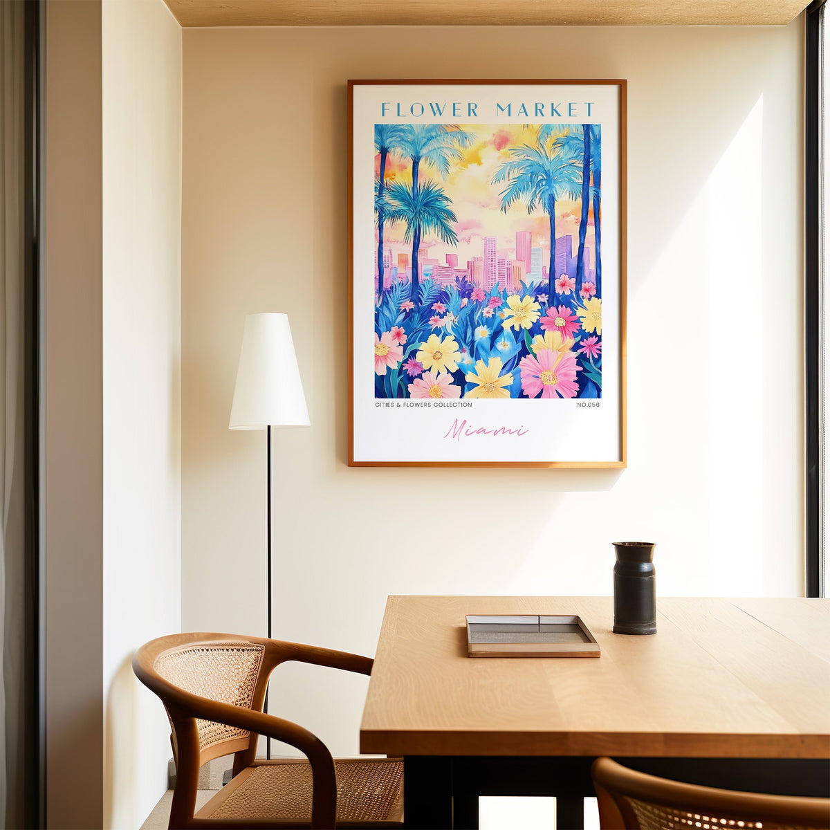 Miami flower market print in an oak frame above a dining table and cane chair