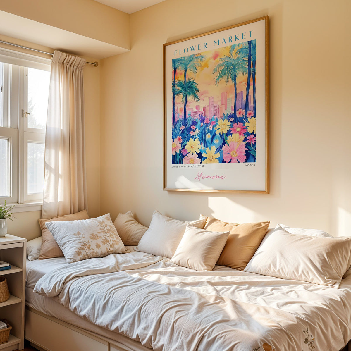 Miami flower market print in an oak frame above a cream daybed in a sunny bedroom