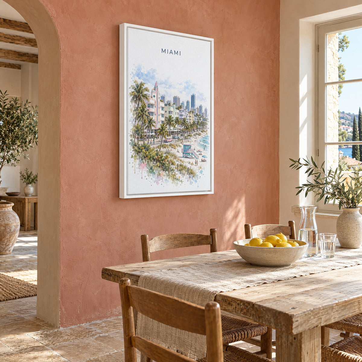 Miami watercolor print as a white floater canvas on a terracotta wall above a rustic dining table