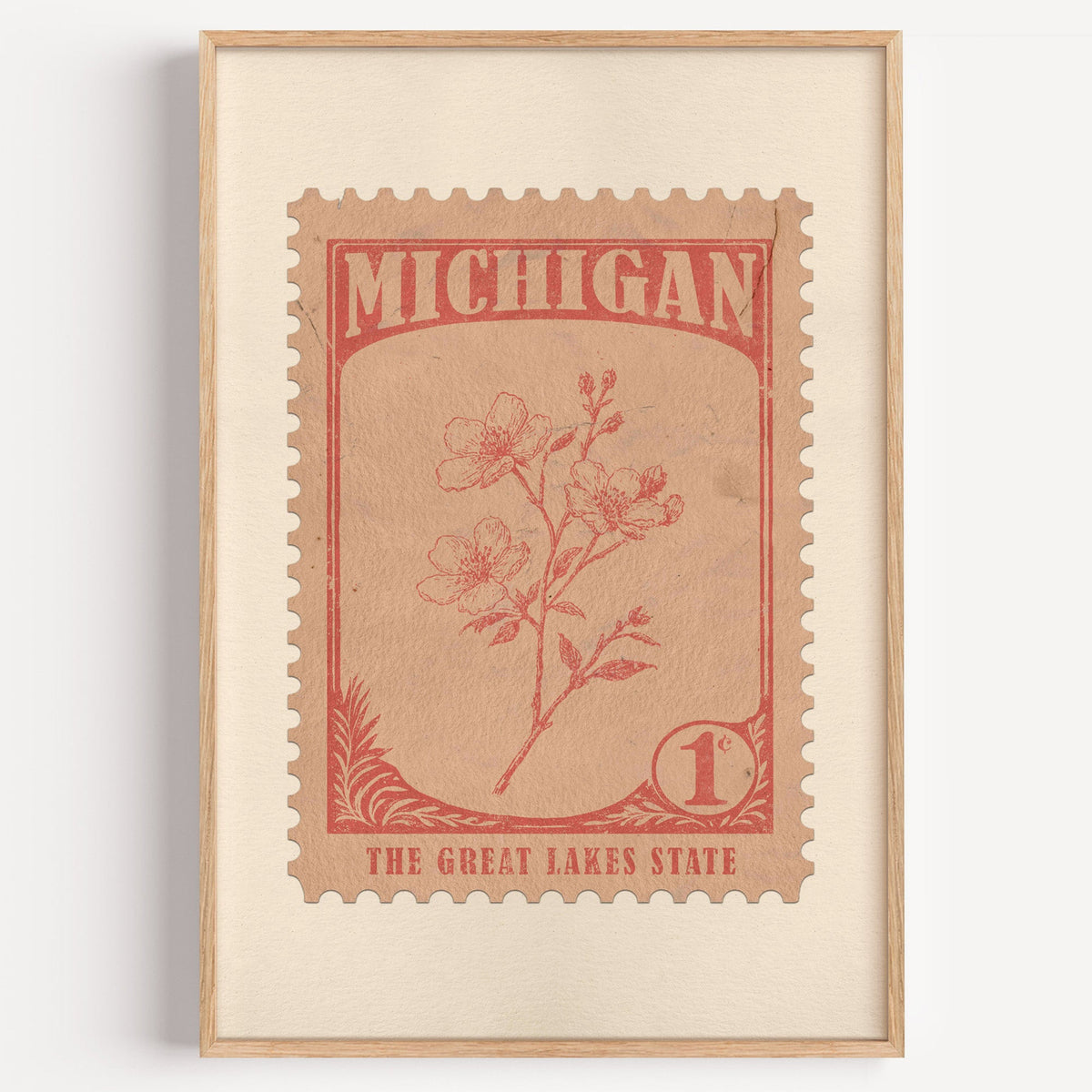 Michigan state flower stamp print in terracotta on peach, light oak frame on a plain white wall