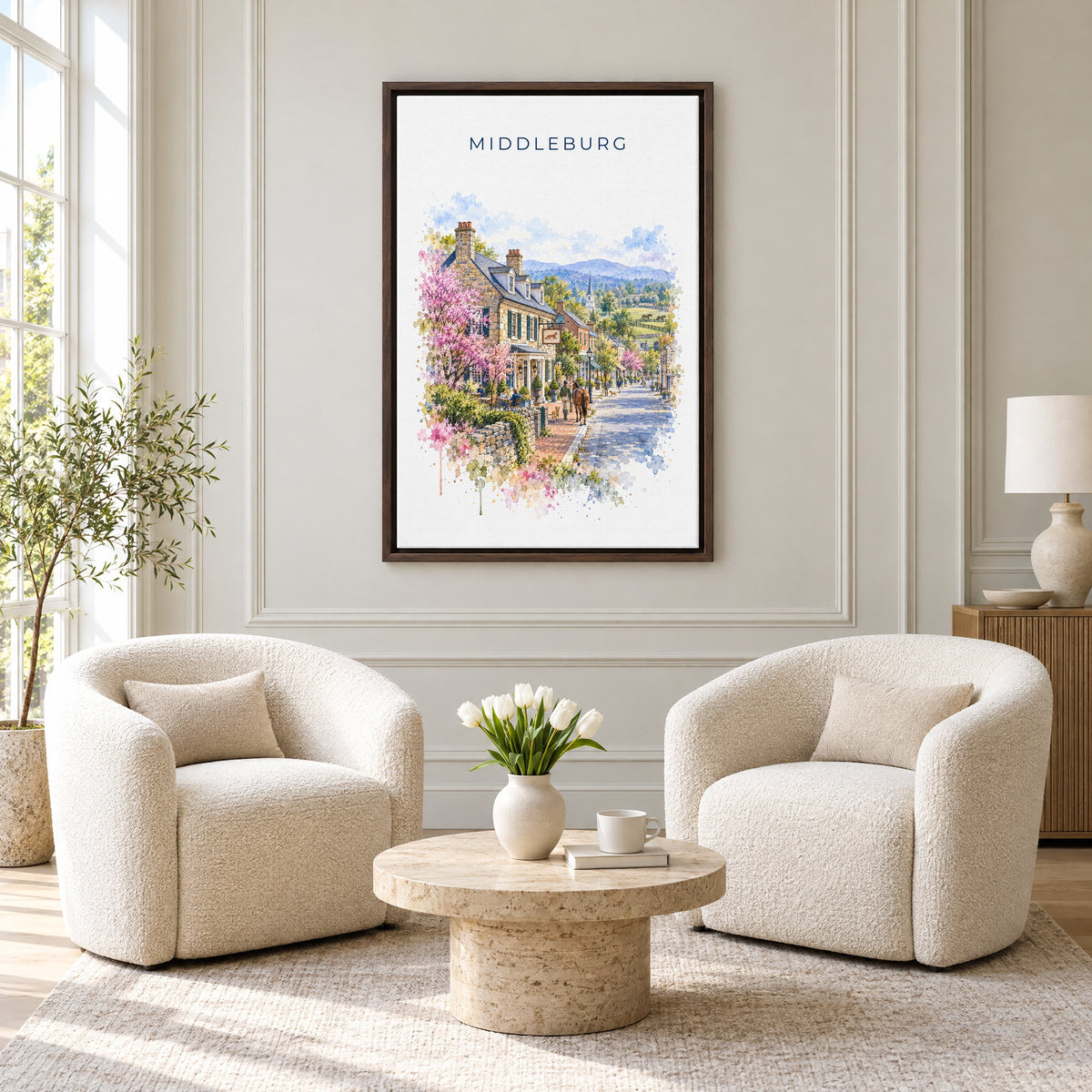 Middleburg, Virginia watercolor print as an espresso floater canvas above two boucle armchairs in a hotel lounge