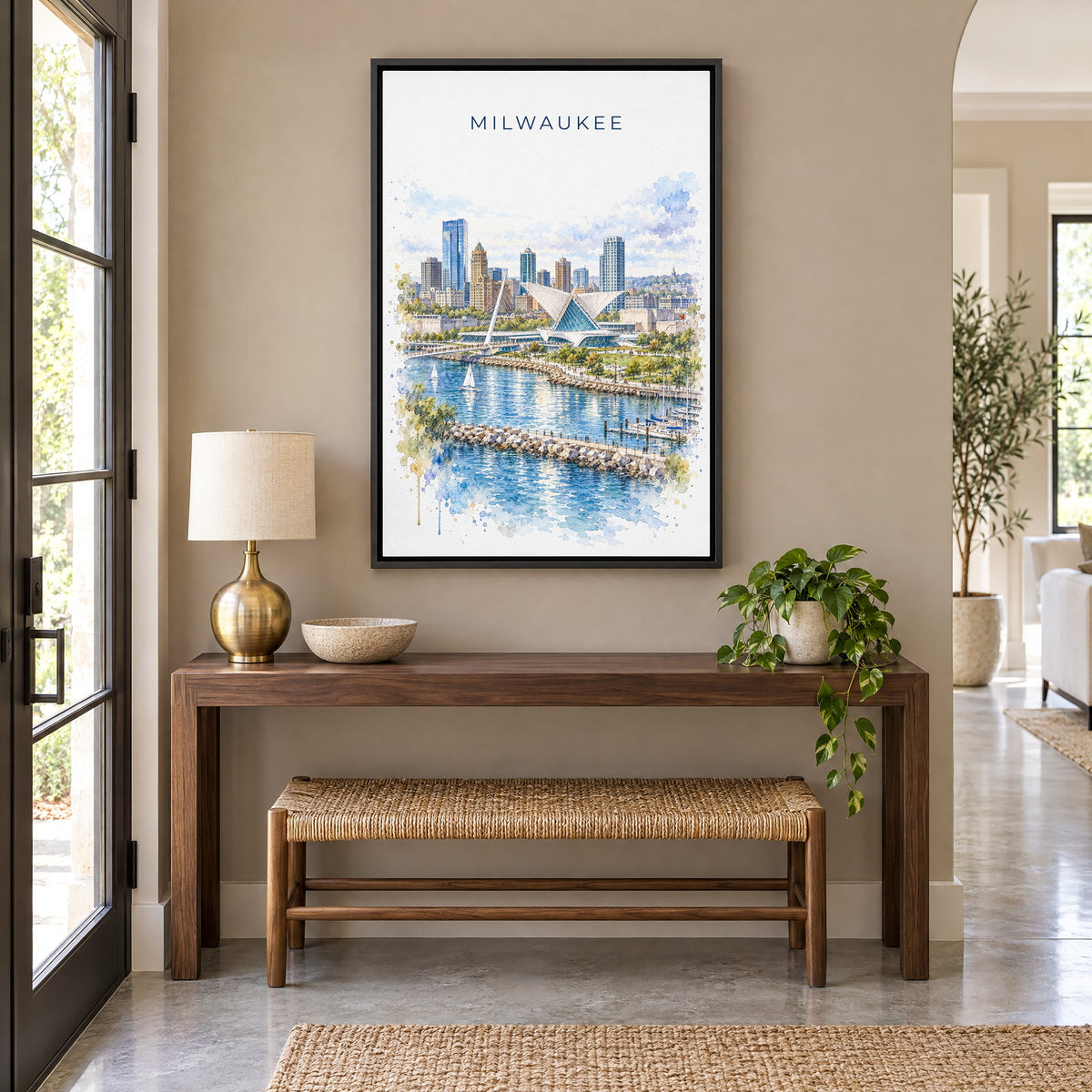 Milwaukee watercolor print as a black floater canvas above a walnut console and woven bench in an entryway