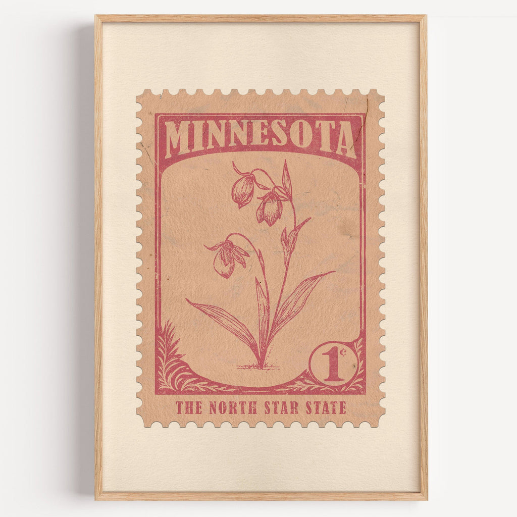 Minnesota state flower stamp print in rose red on blush pink, light oak frame on a plain white wall