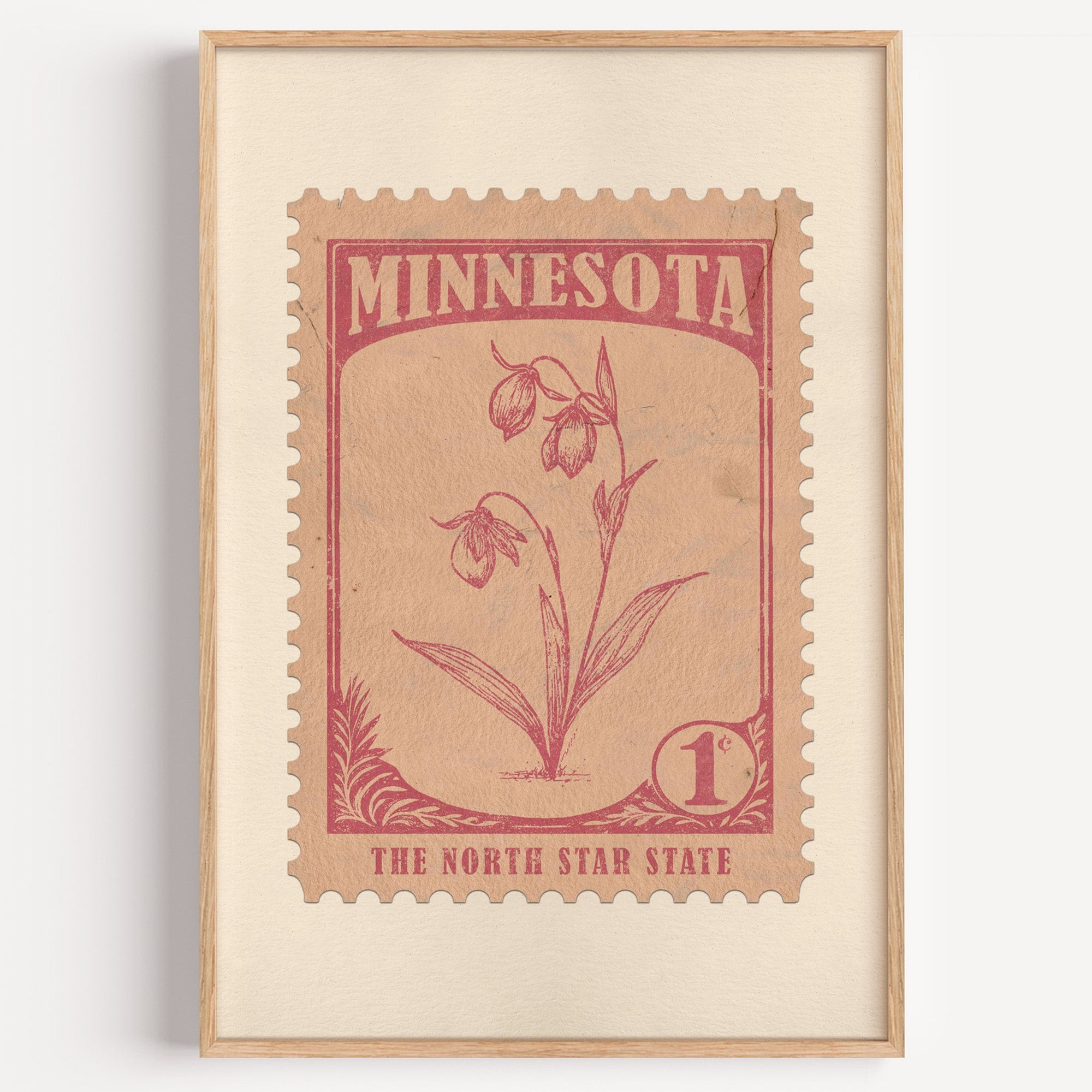 Minnesota state flower stamp print in rose red on blush pink, light oak frame on a plain white wall