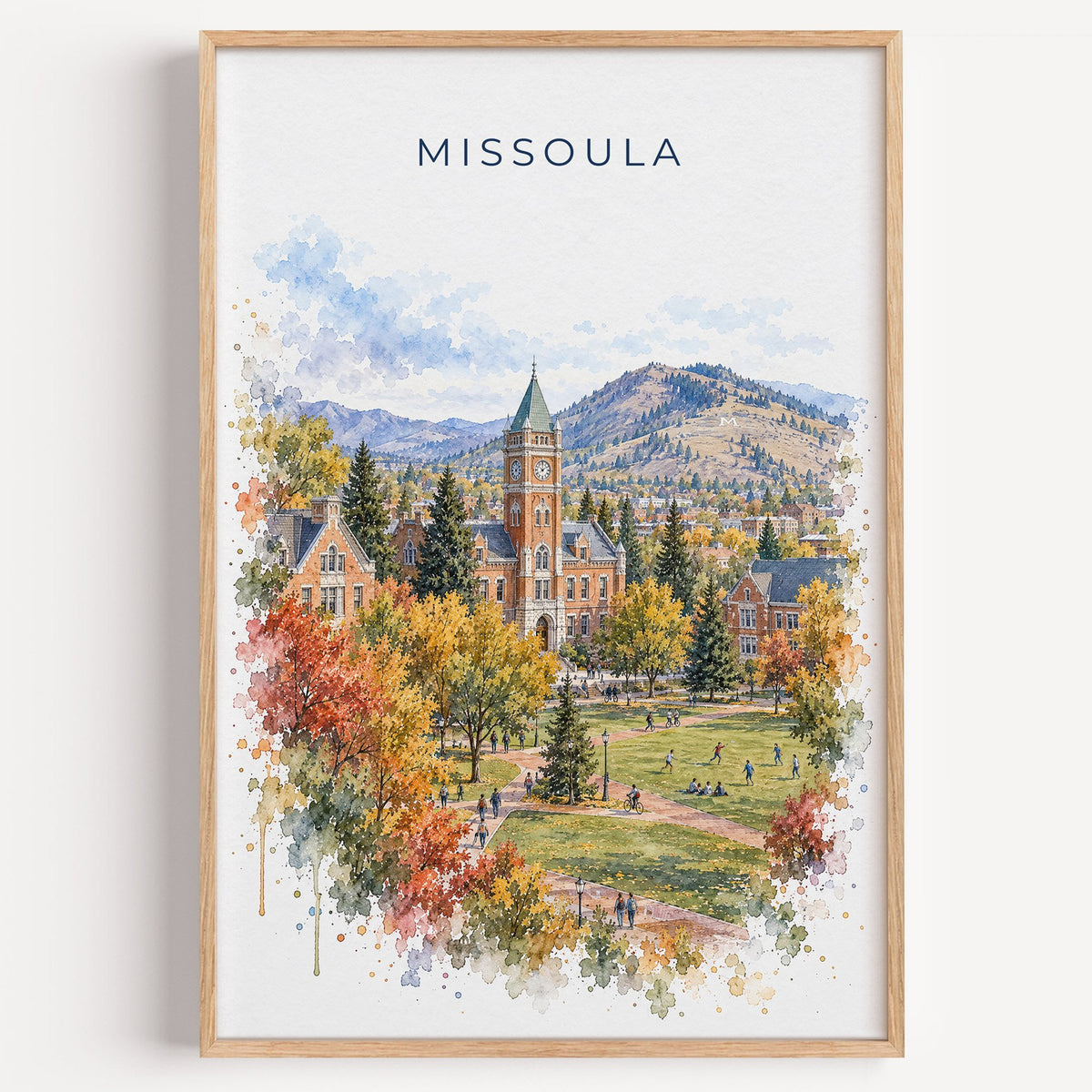 Missoula watercolor print in a light oak frame on a plain white wall
