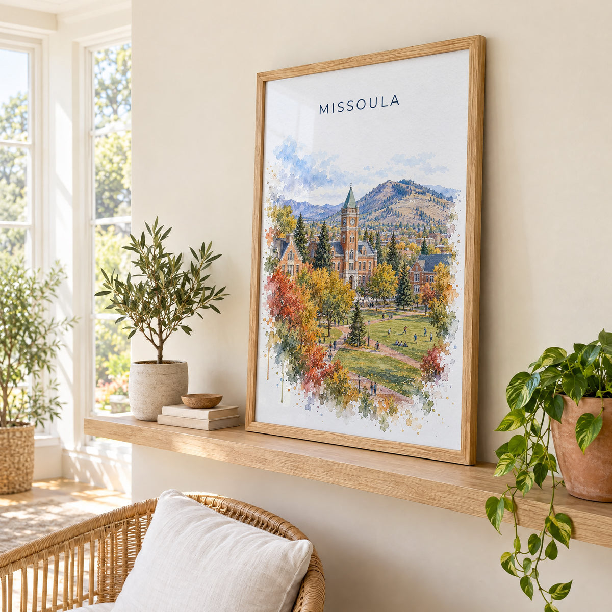 Missoula watercolor print in an oak frame on a picture ledge in a sunlit sunroom