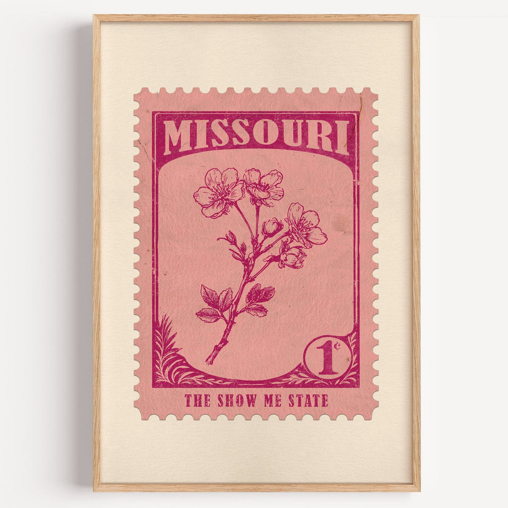 Missouri state flower stamp print in magenta on pink, light oak frame on a plain white wall