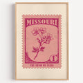 Missouri state flower stamp print in magenta on pink, light oak frame on a plain white wall
