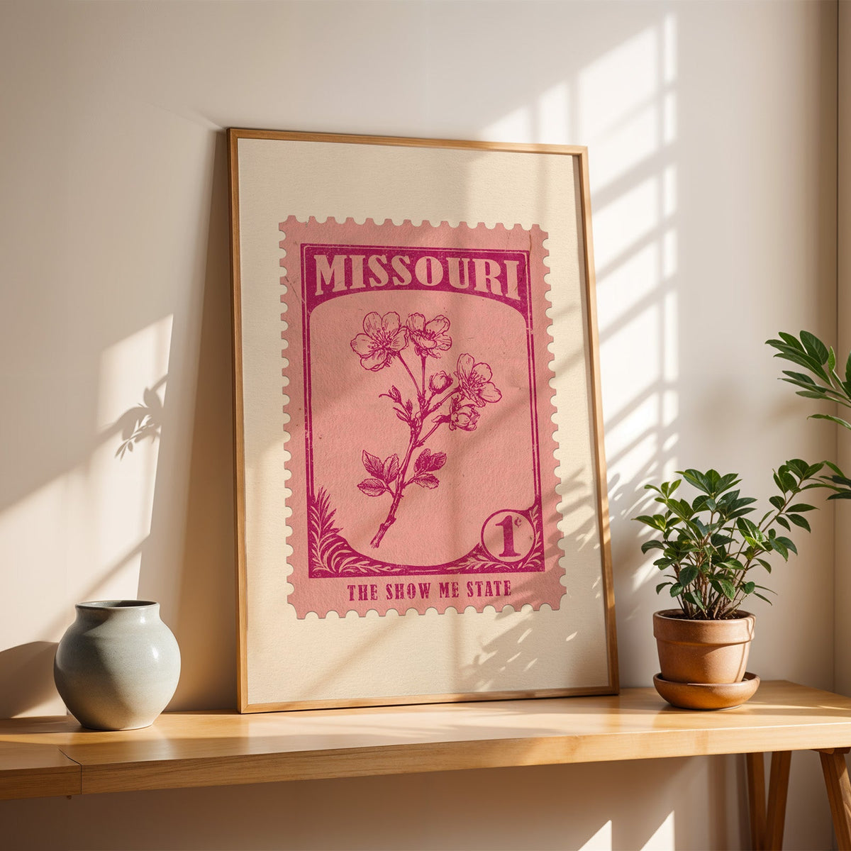 Missouri white hawthorn blossom stamp print in a light oak frame leaning on a wooden table beside a vase