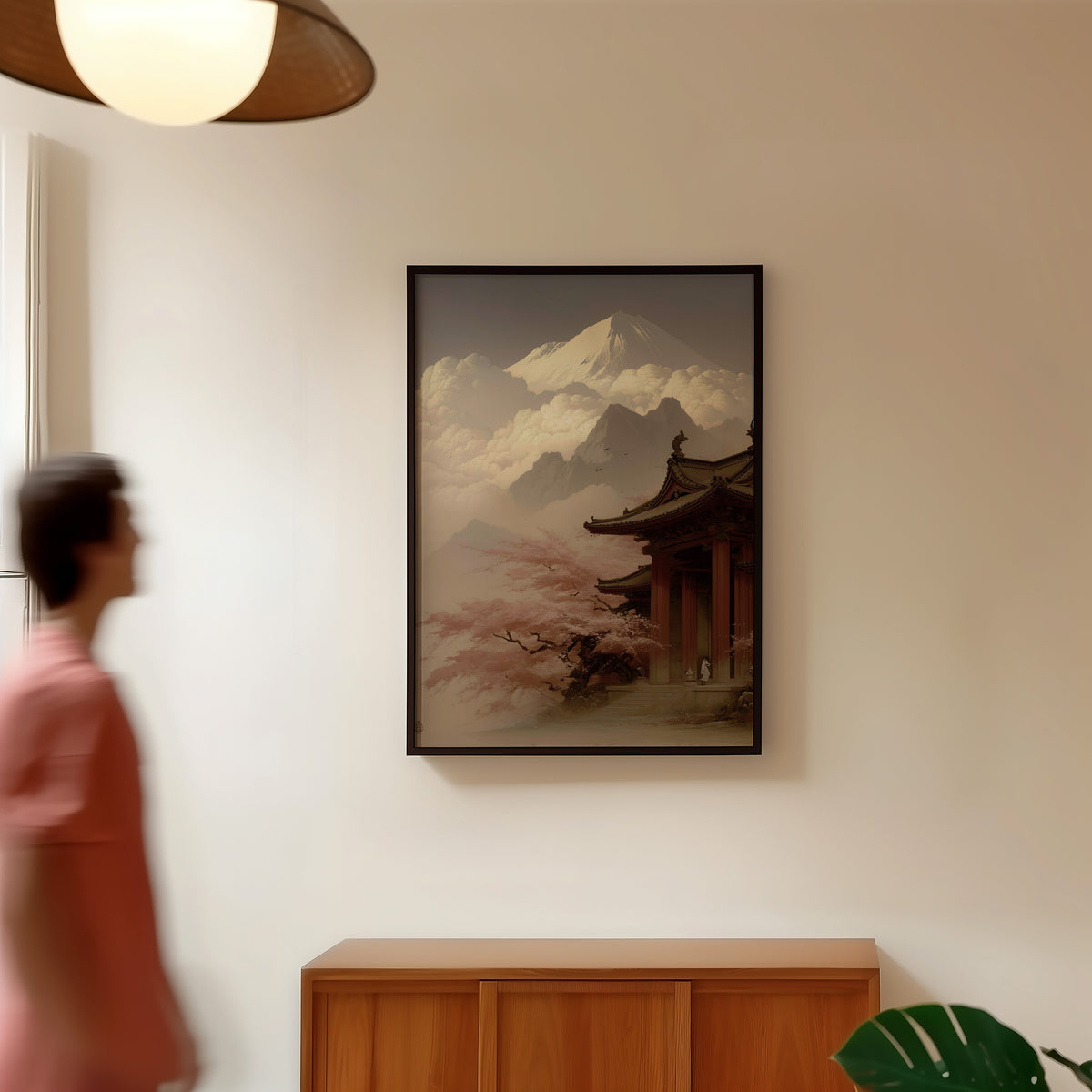 Misty sepia Mount Fuji temple print in a black frame in a hallway under a rattan pendant