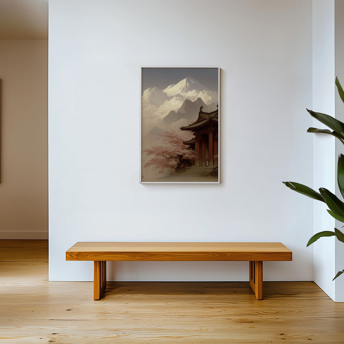 Misty sepia Mount Fuji temple print shown in a white frame above a wooden entryway bench