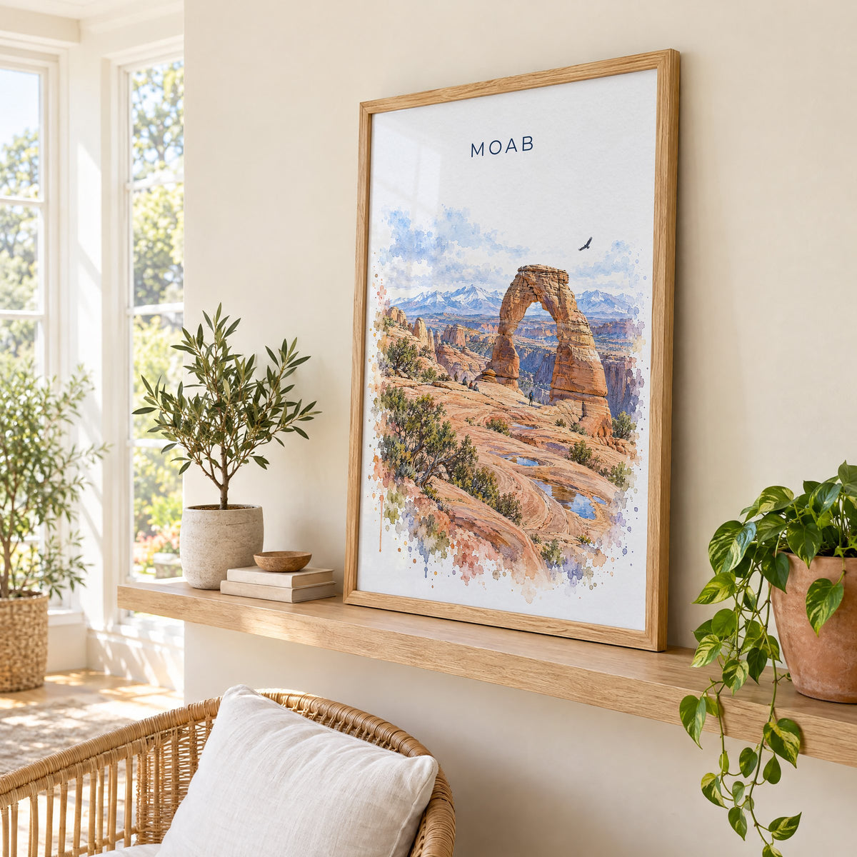 Moab watercolor print in an oak frame on a picture ledge in a sunlit sunroom