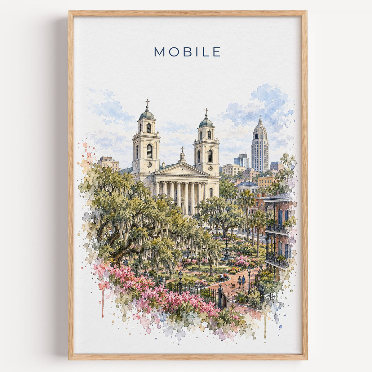 Mobile, Alabama watercolor print in a light oak frame on a plain white wall