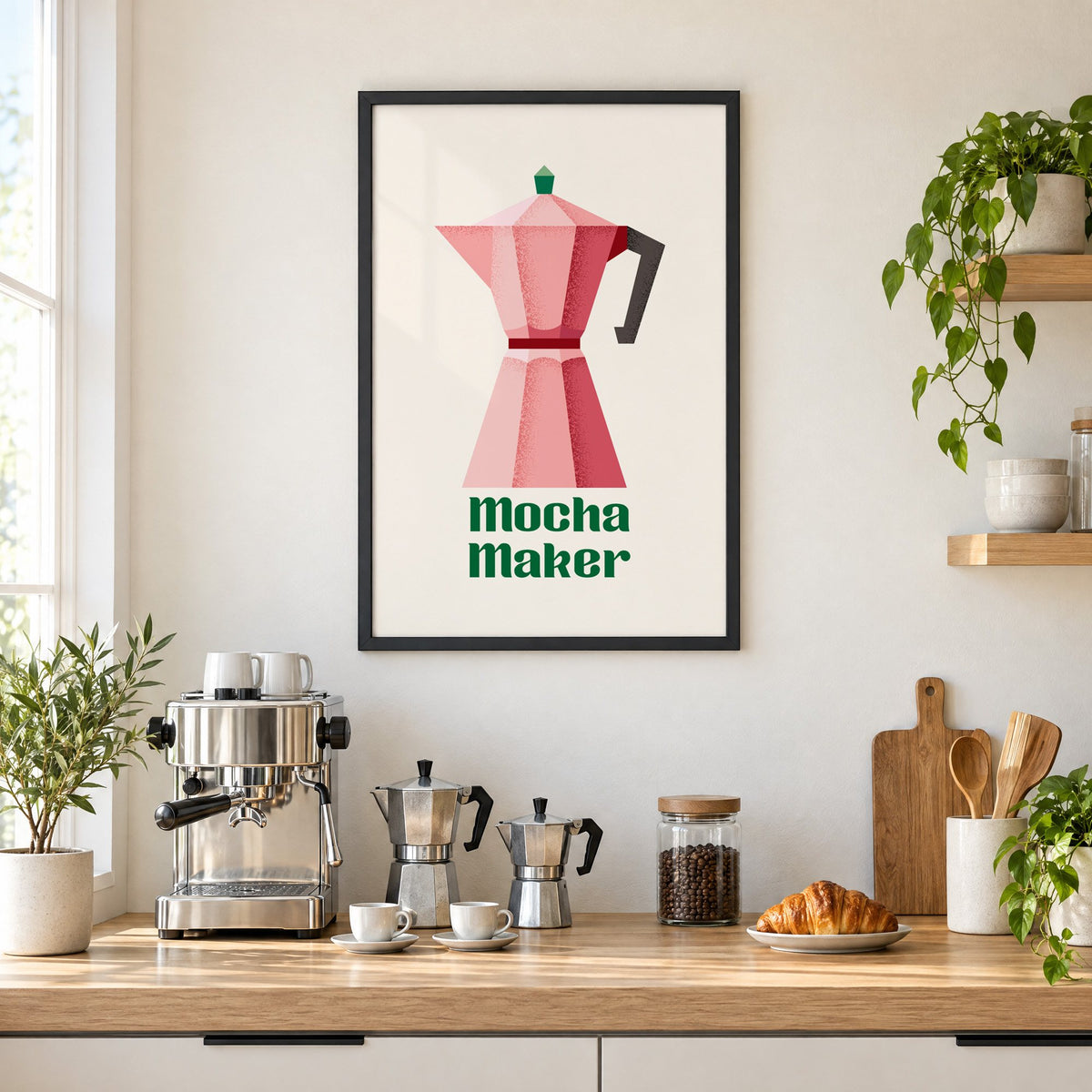 Mocha Maker pink moka pot print in a black frame above a home espresso bar with moka pots and espresso cups