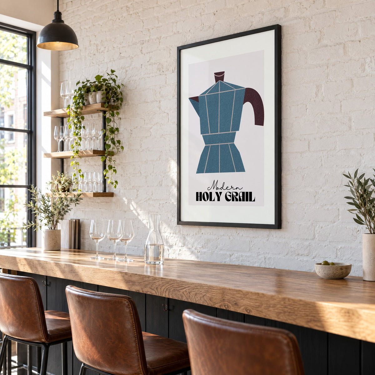 Modern Holy Grail moka pot print in a black frame on a white brick wall above a wine bar counter
