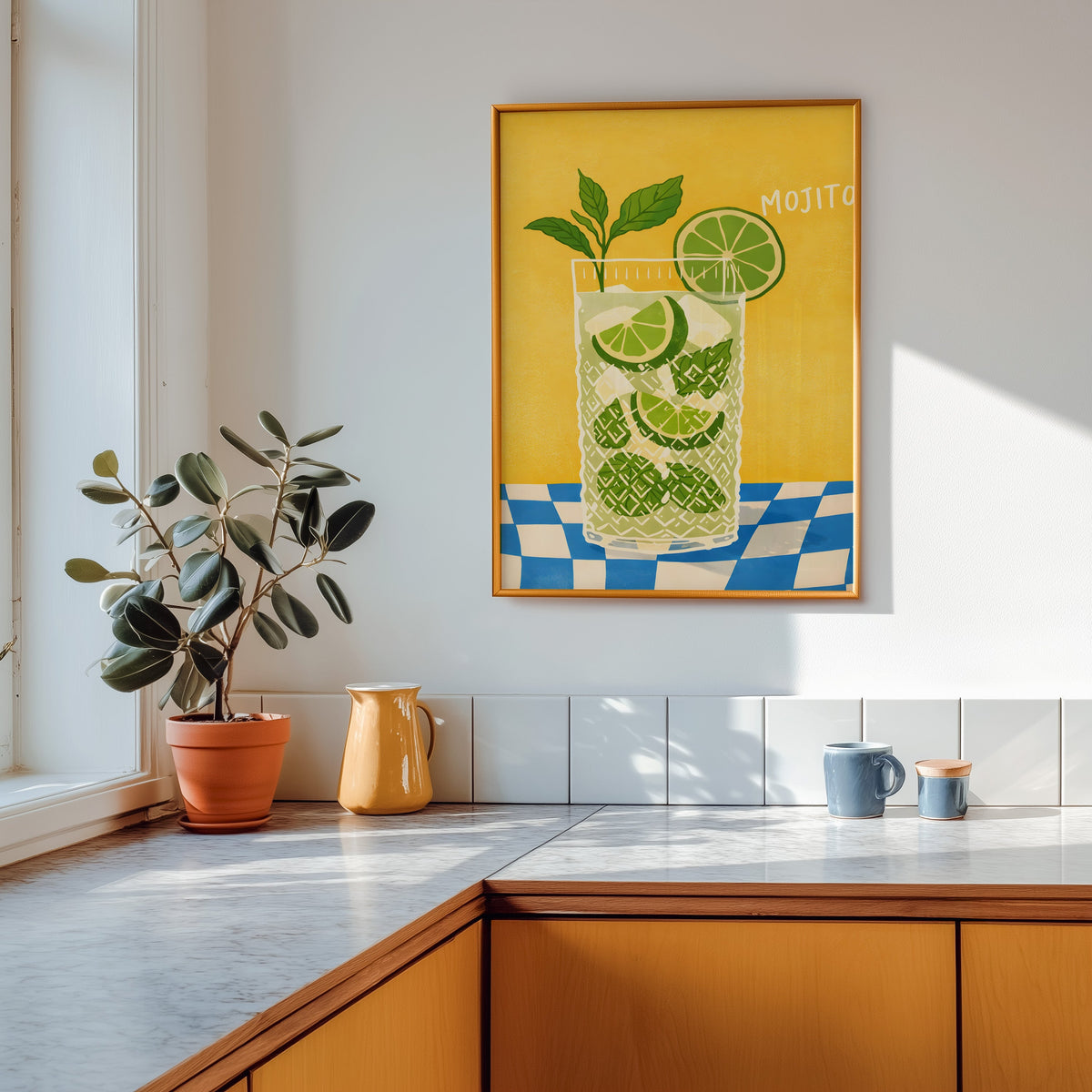 Mojito print in a gold frame above a marble counter with a yellow ceramic jug