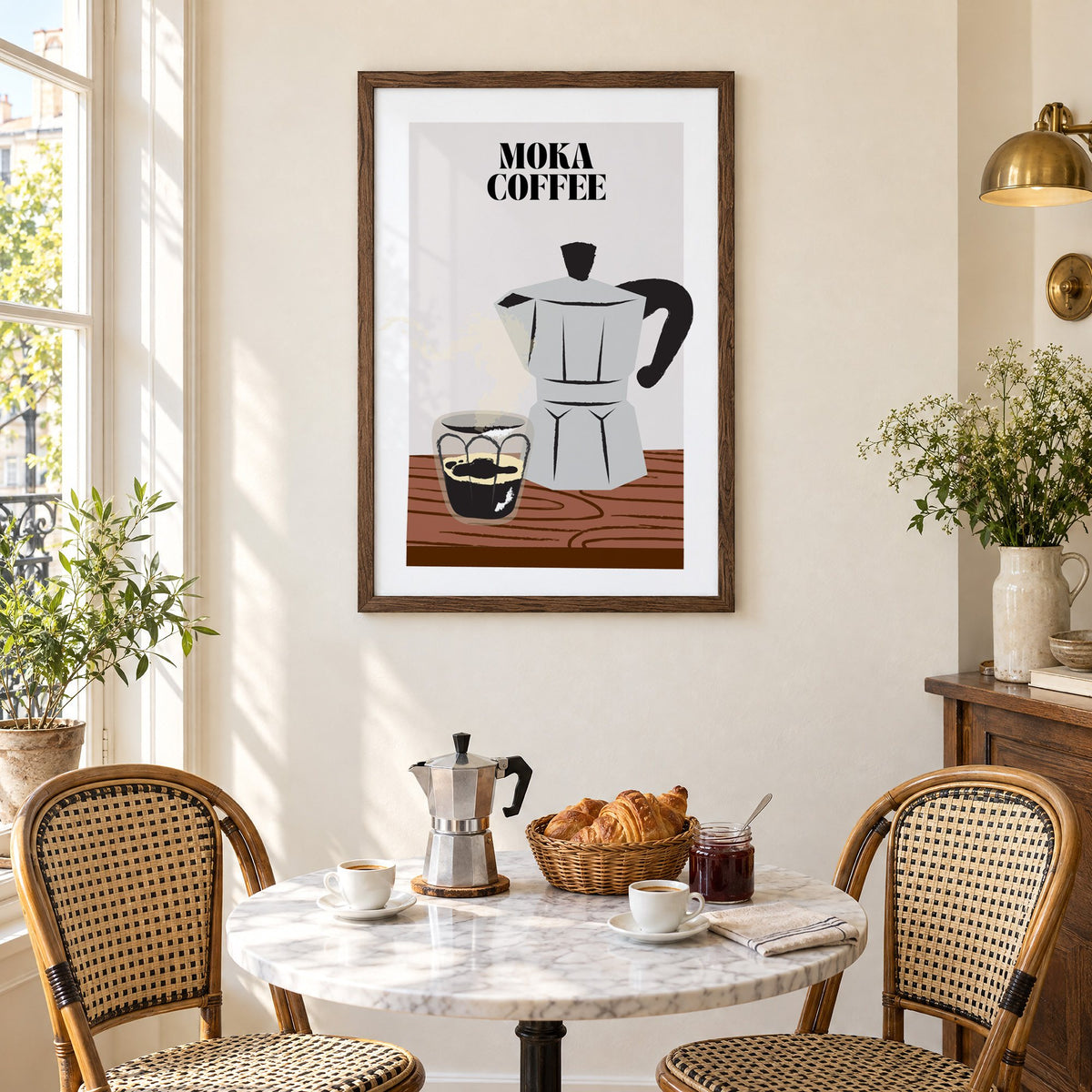 MOKA COFFEE silver pot wood table print in a walnut frame above a marble bistro table with croissants and rattan chairs