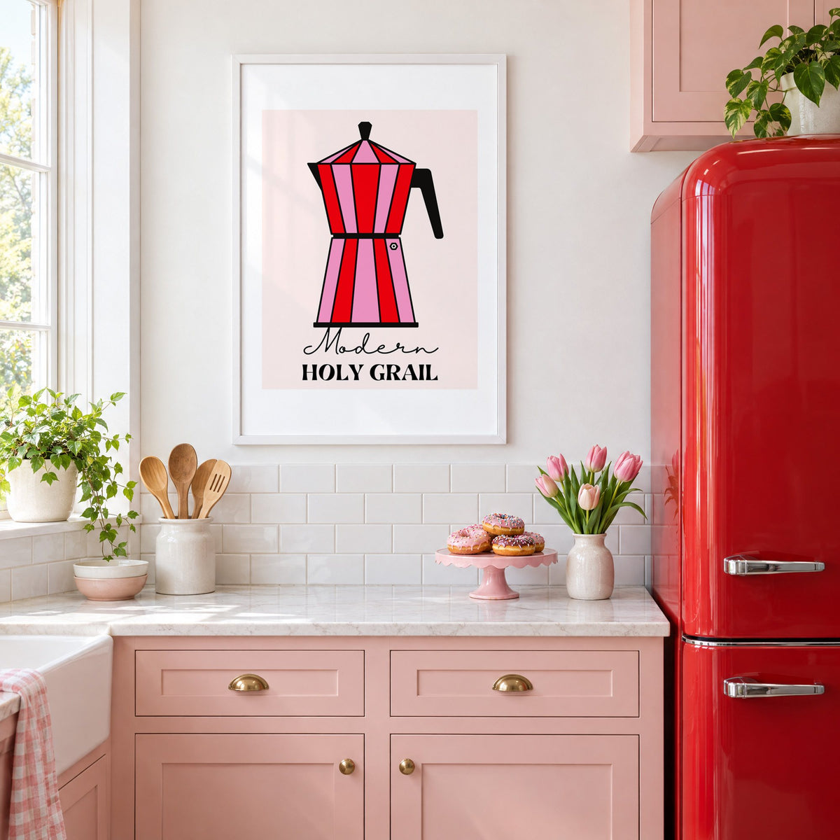 Moka pot pink and red striped print in a white frame in a pink kitchen beside a red retro fridge