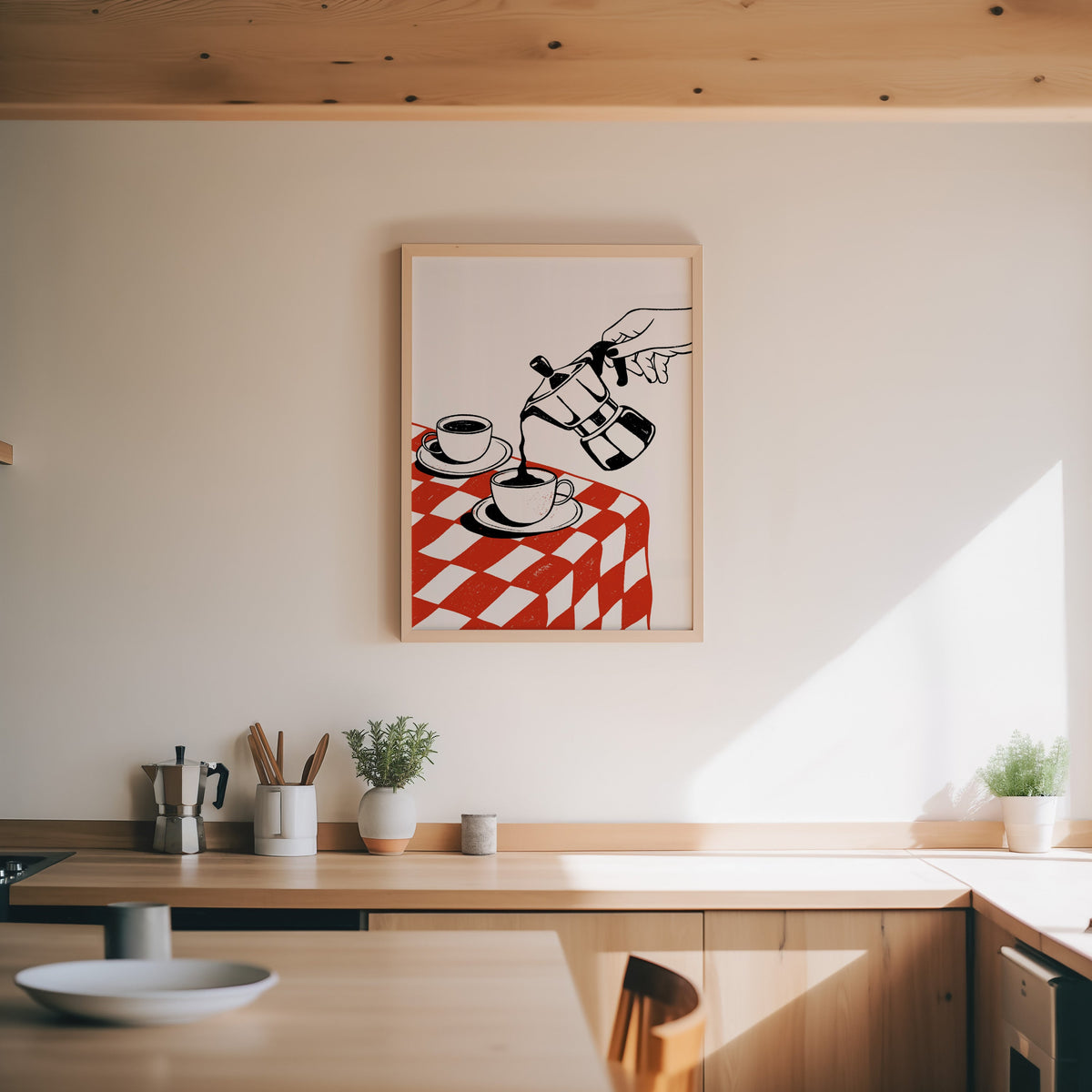 Moka pot print in an oak frame above a wood counter with a real moka pot below