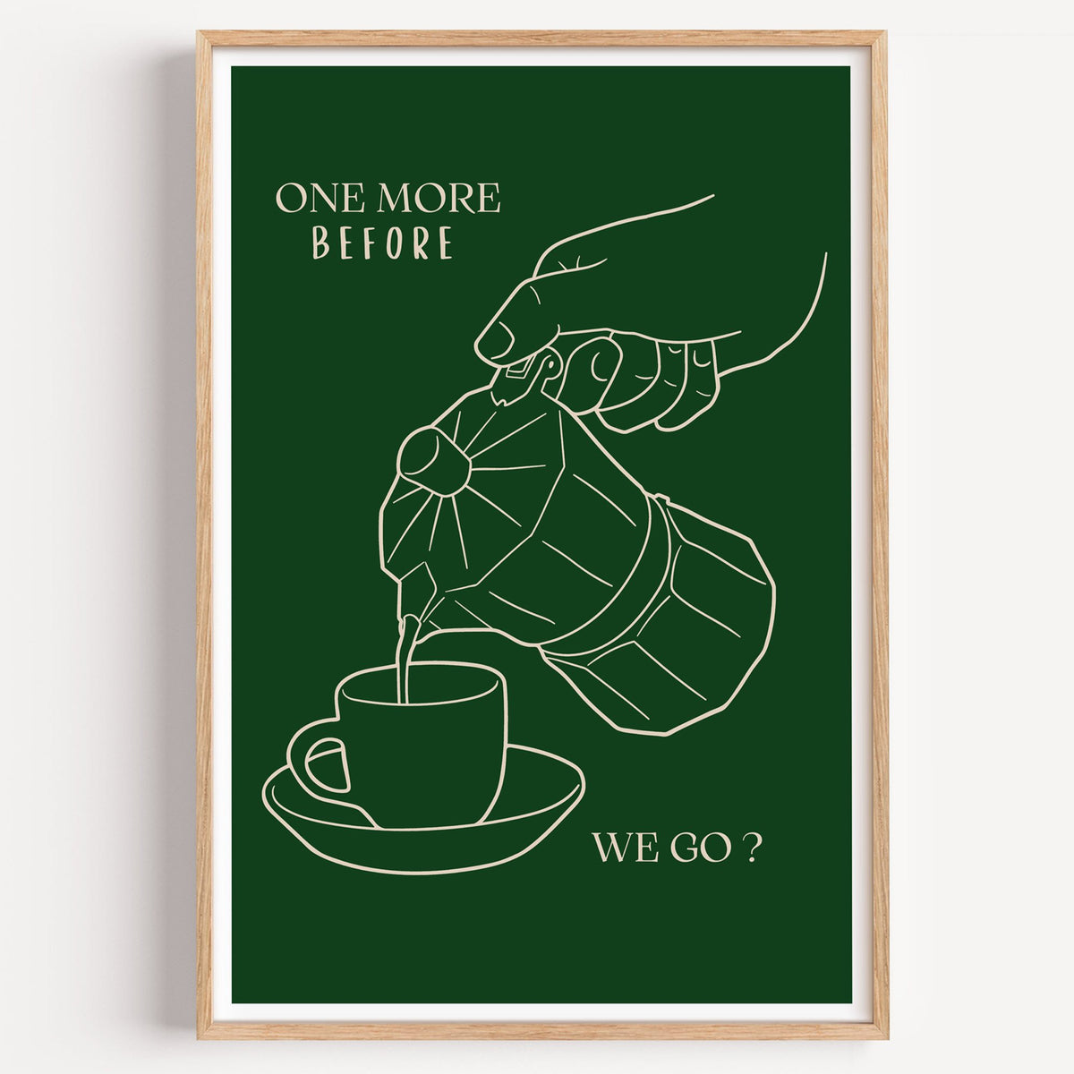 ONE MORE BEFORE WE GO? moka pot line print in a light oak frame on a plain white wall