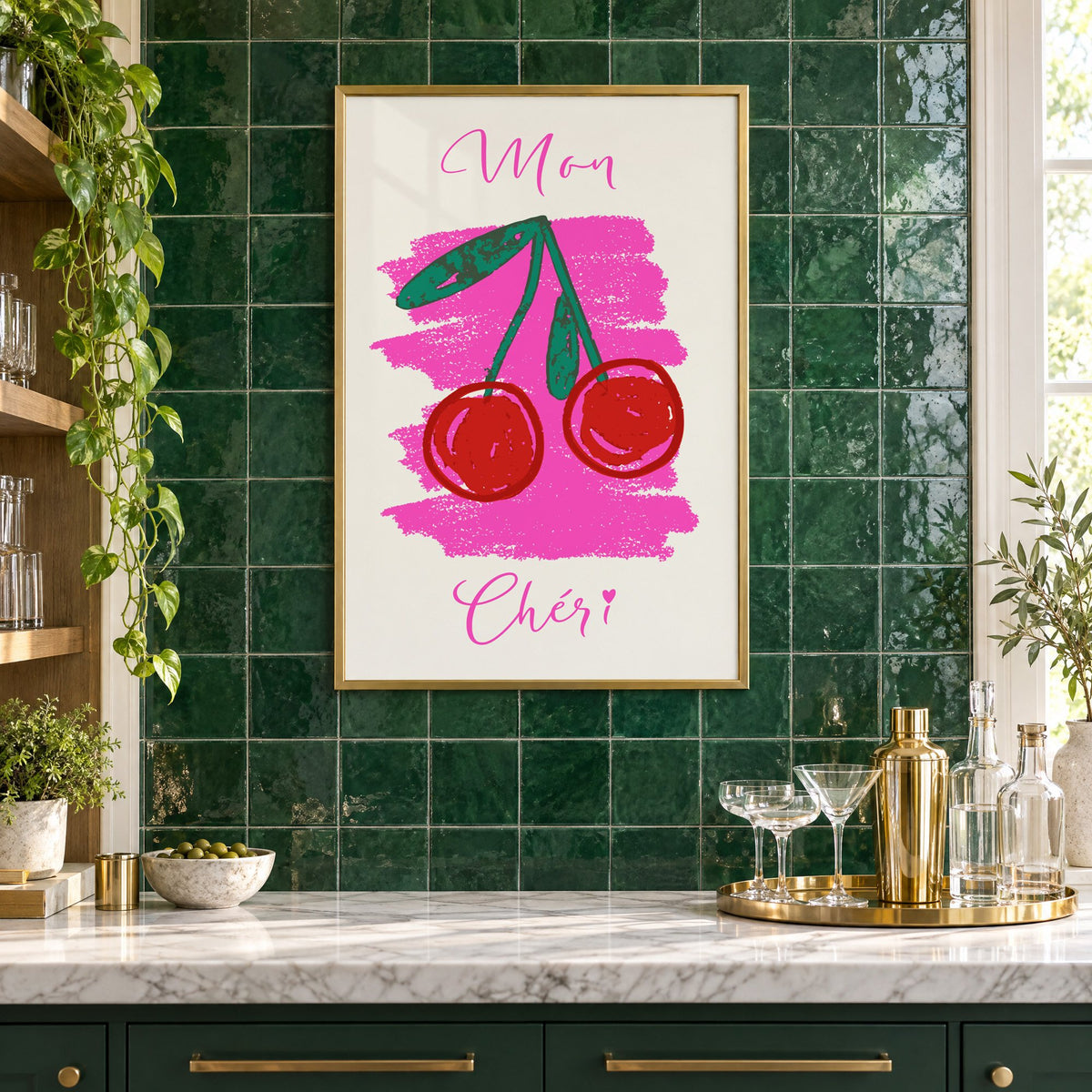 Mon Chéri cherries crayon print in a brass frame on emerald green tiles above a home bar with coupe glasses