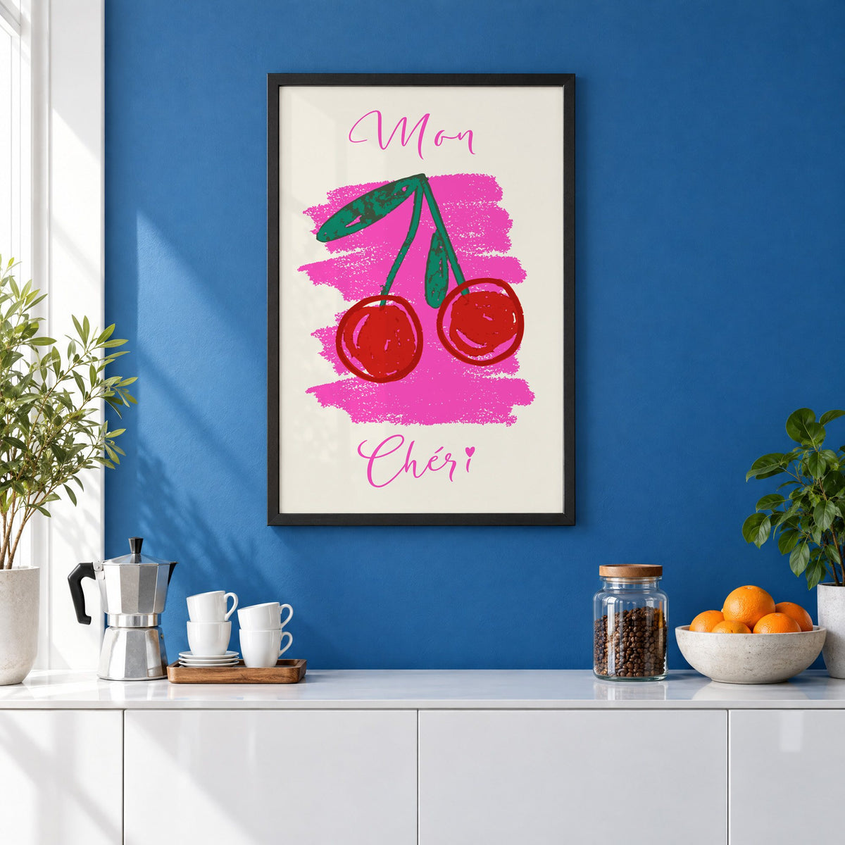 Mon Chéri cherries crayon print in a black frame on a cobalt blue wall above a coffee station