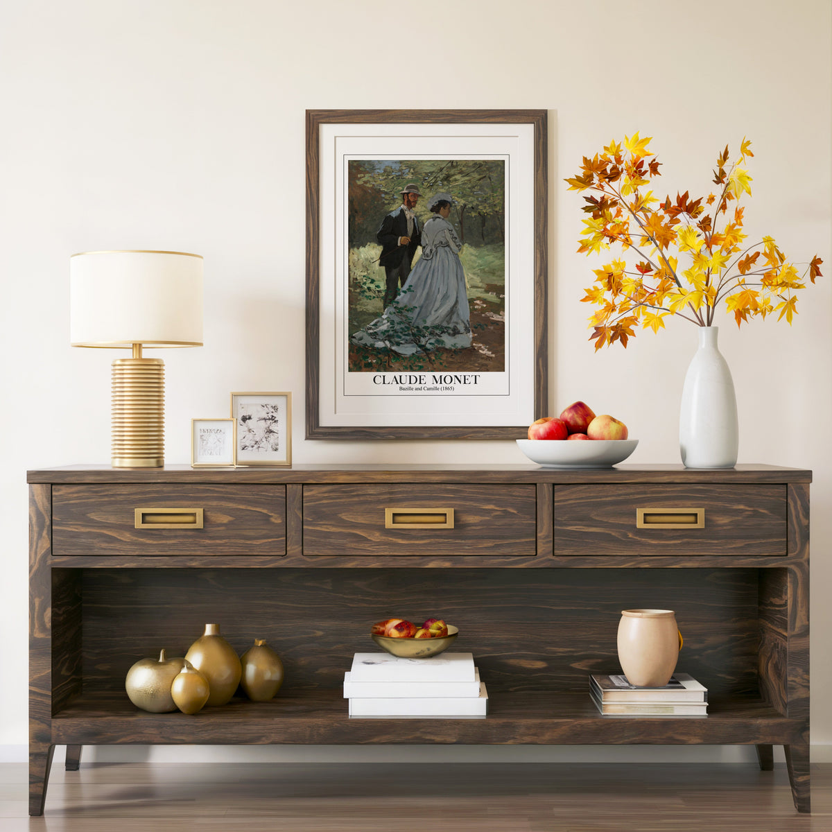 Bazille and Camille print in a walnut frame above a console with autumn branches