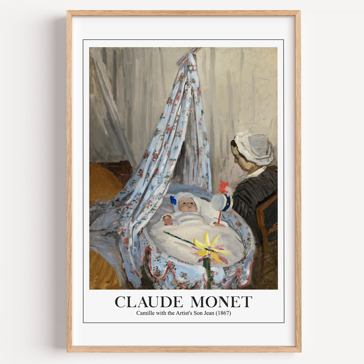 Monet Camille with the Artist's Son Jean print in a light oak frame on a white wall