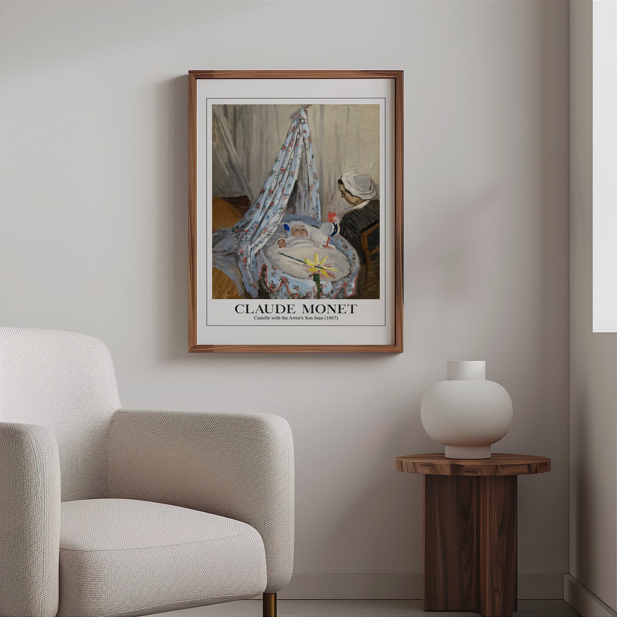 Monet cradle print in a slim walnut frame above a bouclé armchair
