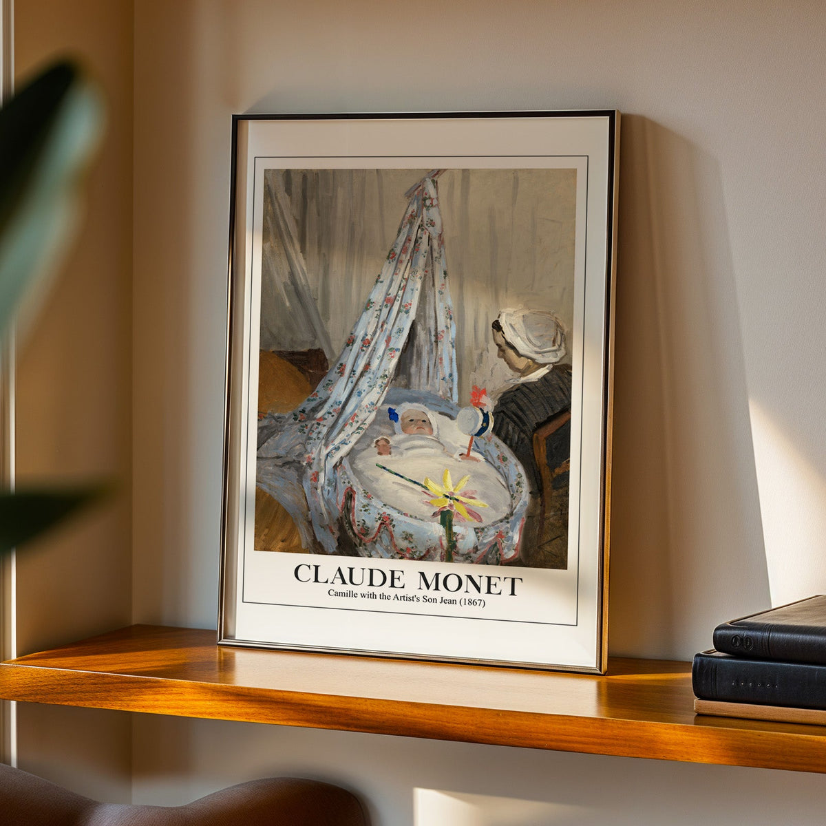Camille with the Artist's Son Jean print in a black frame on a walnut shelf