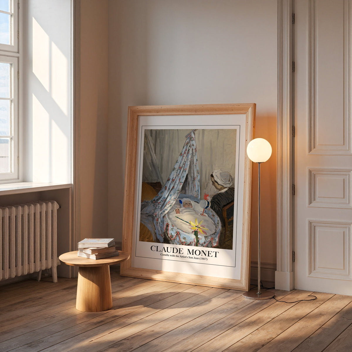 Monet cradle print in a wide pine frame leaning by a sunlit window