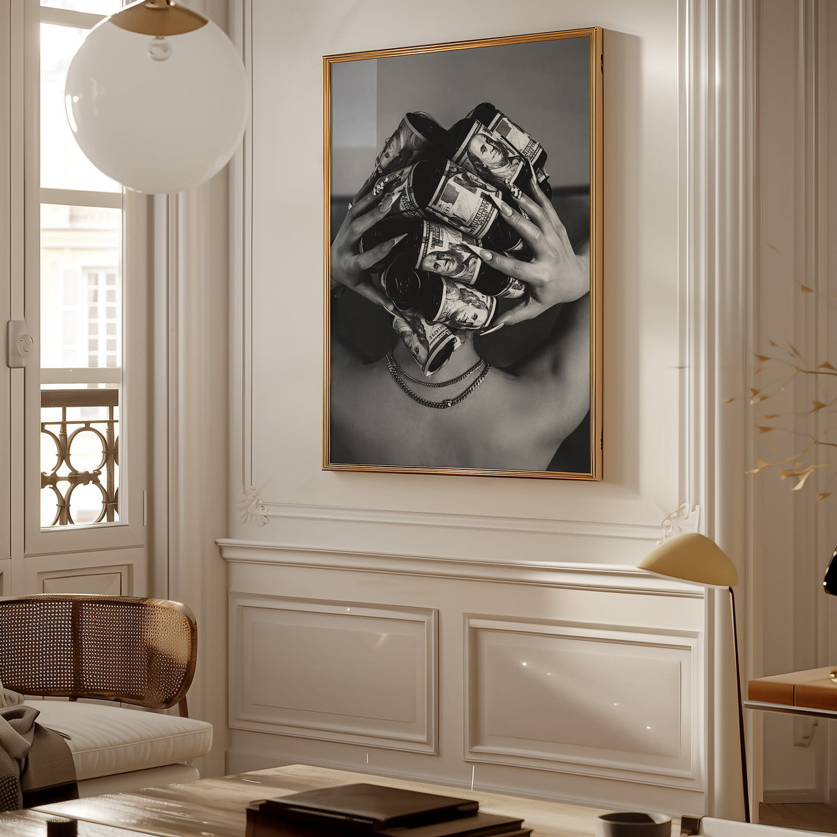 Hair curlers wrapped in dollar bills from behind print shown in a gold frame in a Parisian paneled living room