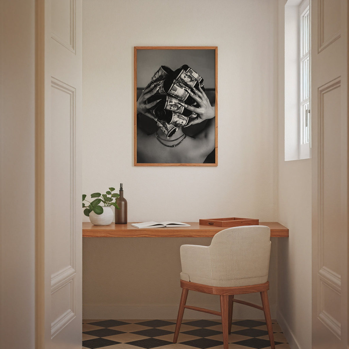 Hair curlers wrapped in dollar bills from behind print in an oak frame above a home office desk nook