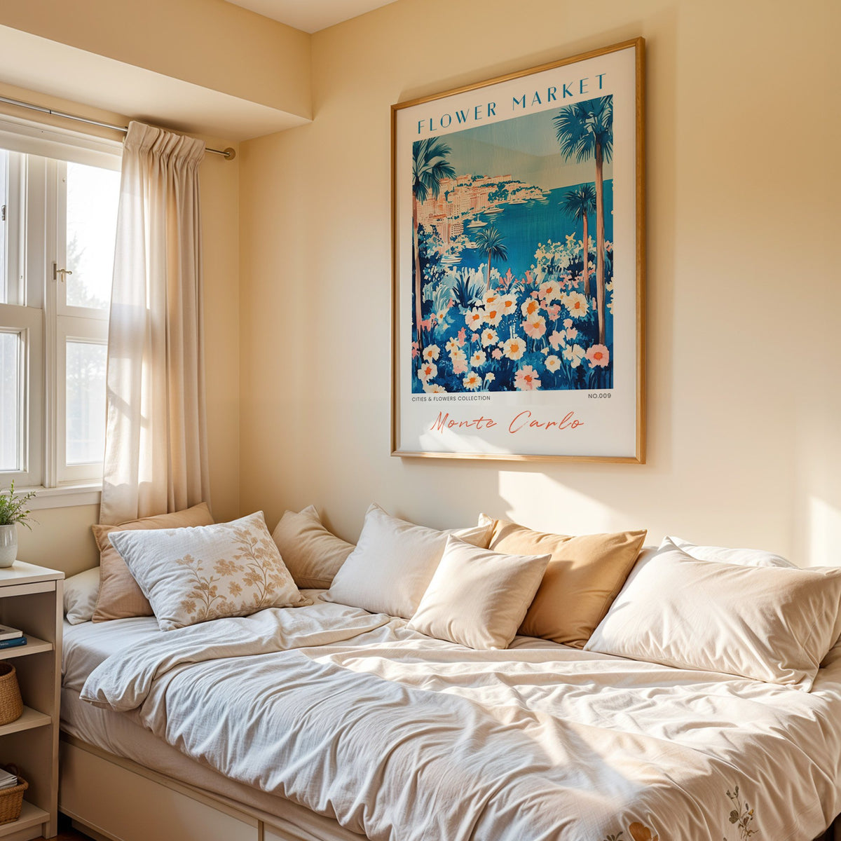 Monte Carlo flower market print in an oak frame above a cream daybed in a sunny bedroom
