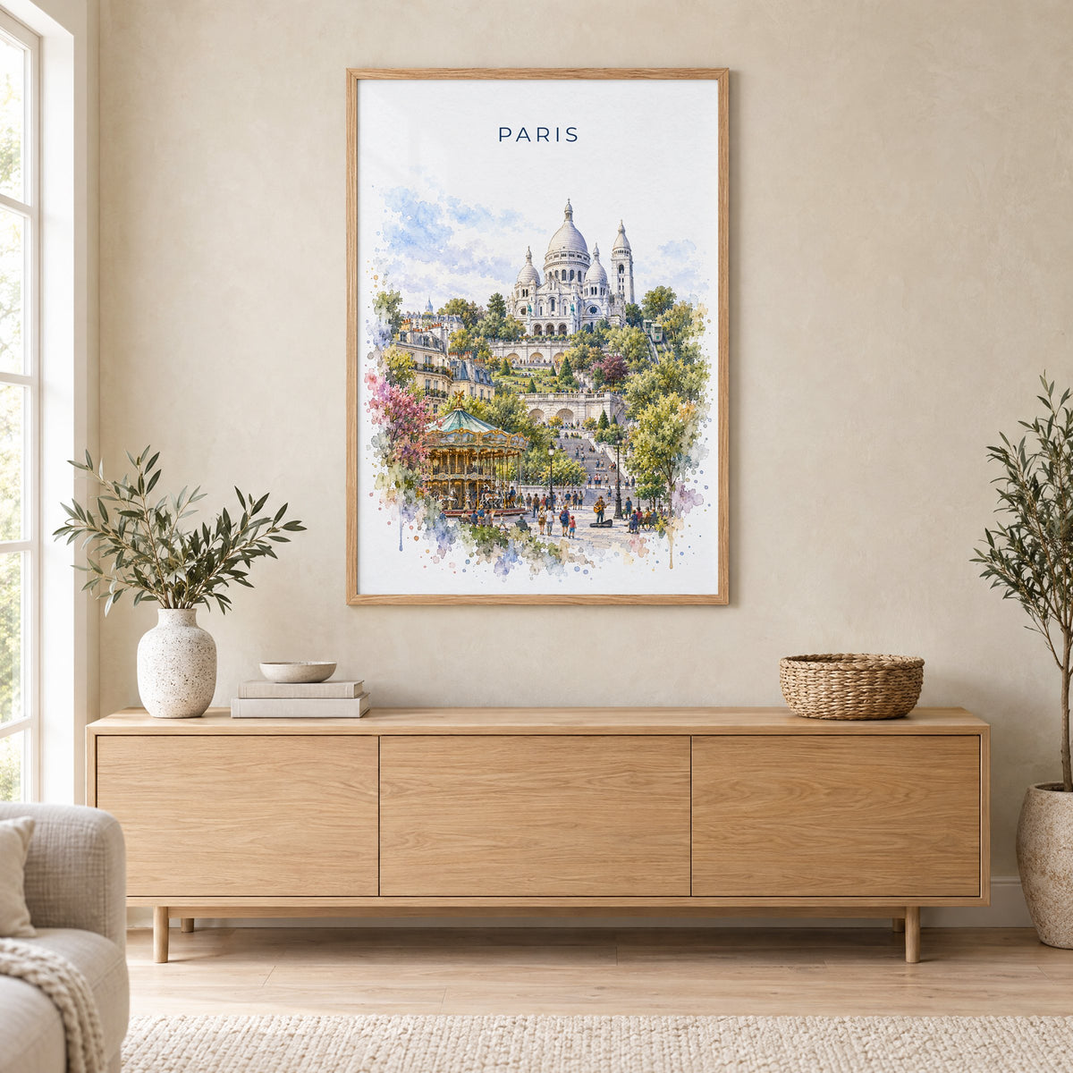 Montmartre Paris watercolor print in an oak frame above a light wood sideboard in a Scandinavian living room