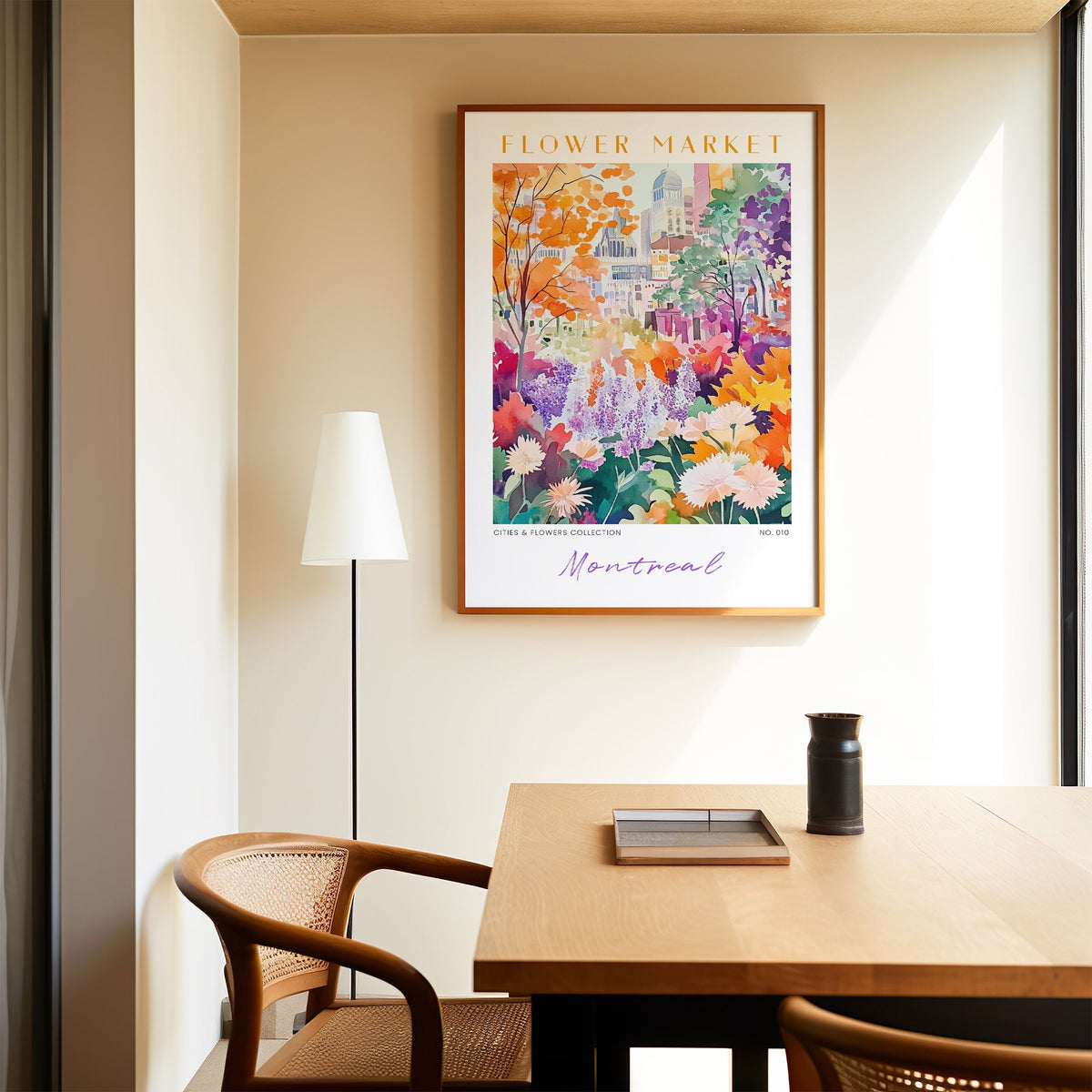 Montreal flower market print in an oak frame above a dining table and cane chair
