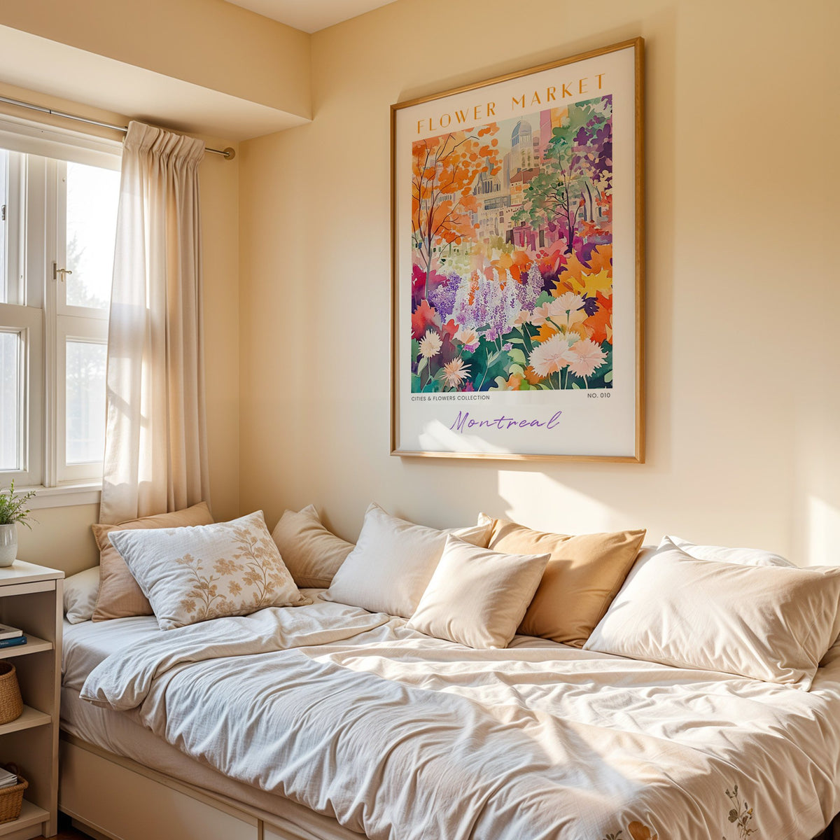 Montreal flower market print in an oak frame above a cream daybed in a sunny bedroom