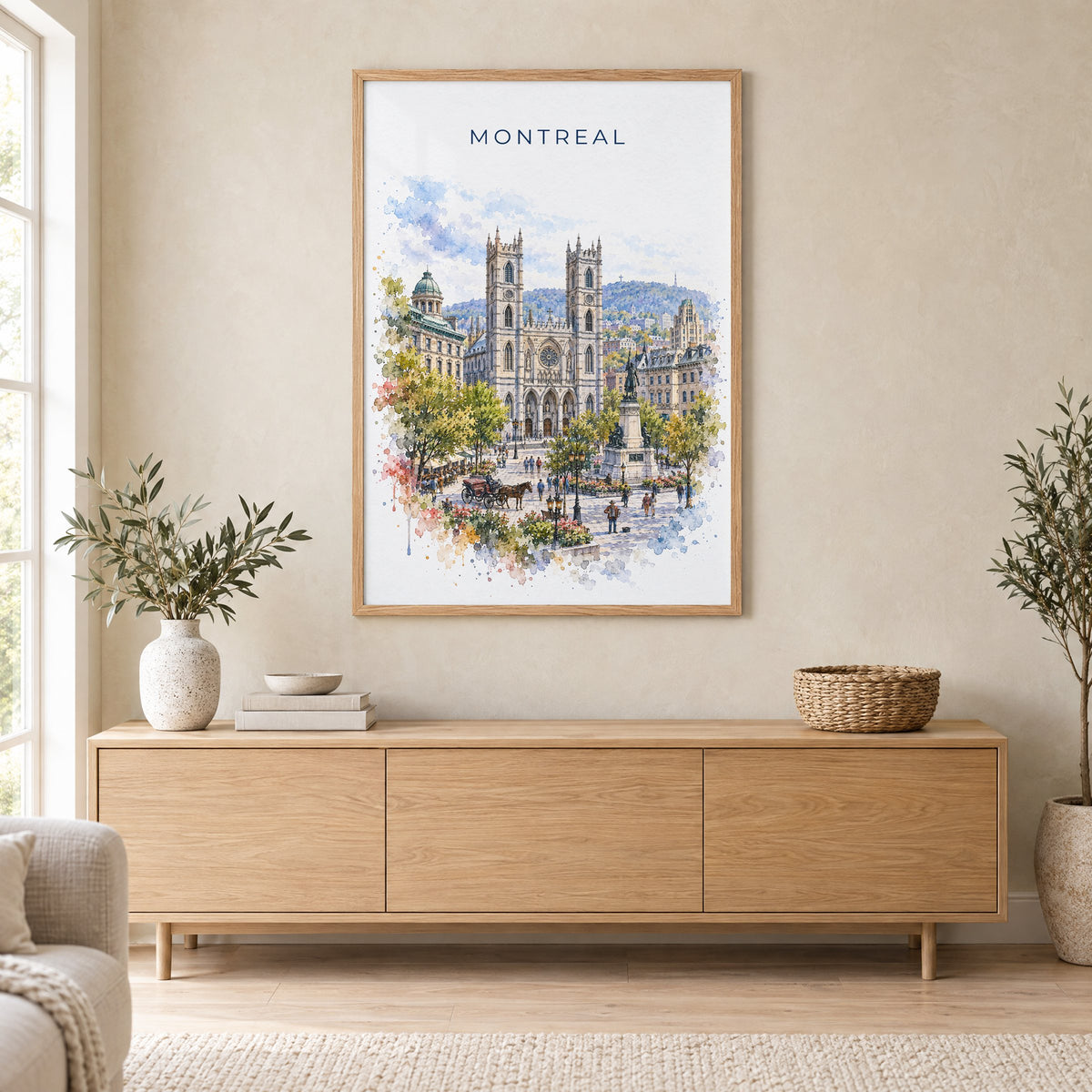 Montreal watercolor print in an oak frame above a light wood sideboard in a Scandinavian living room