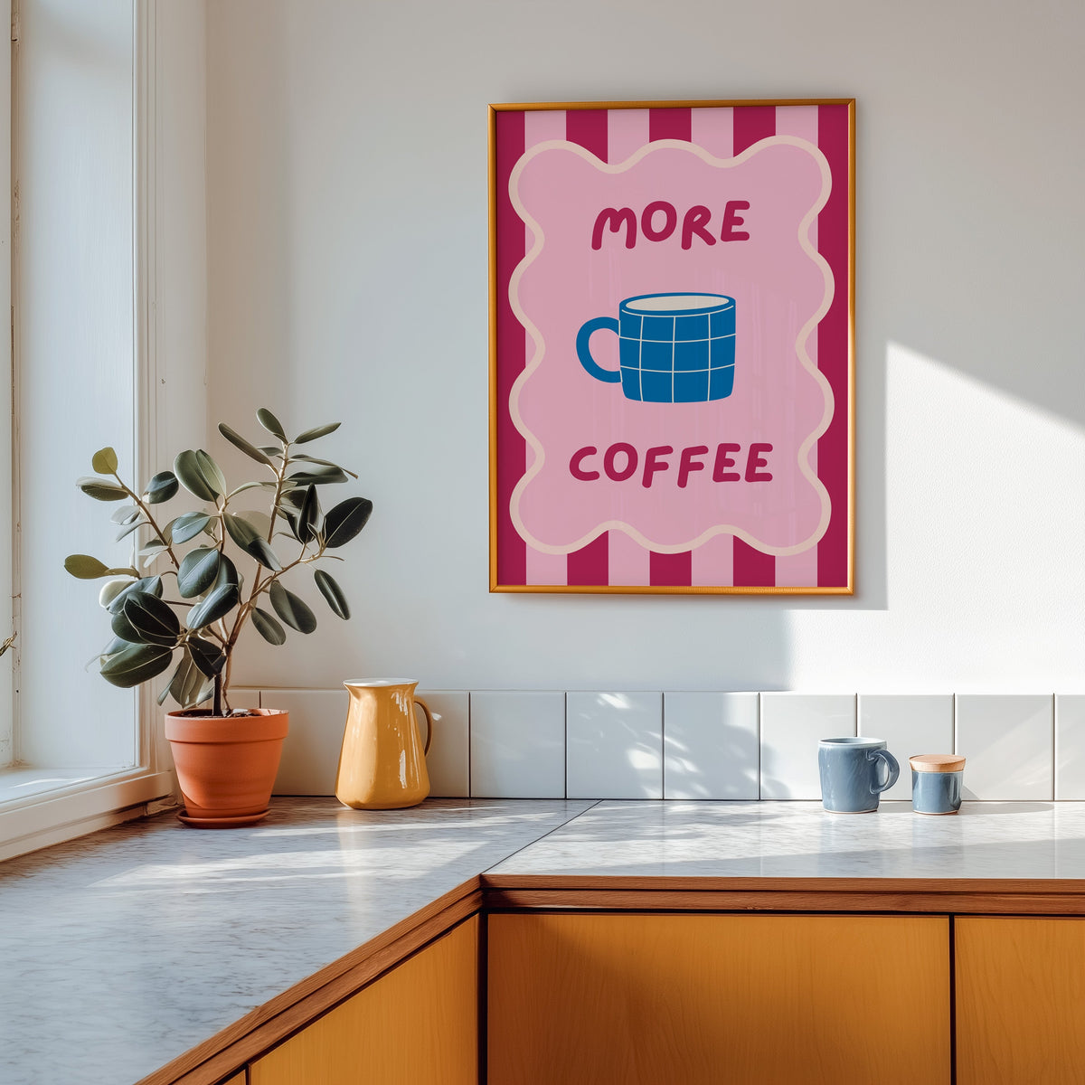 More Coffee mug print shown in a gold frame above a marble counter with a yellow ceramic jug